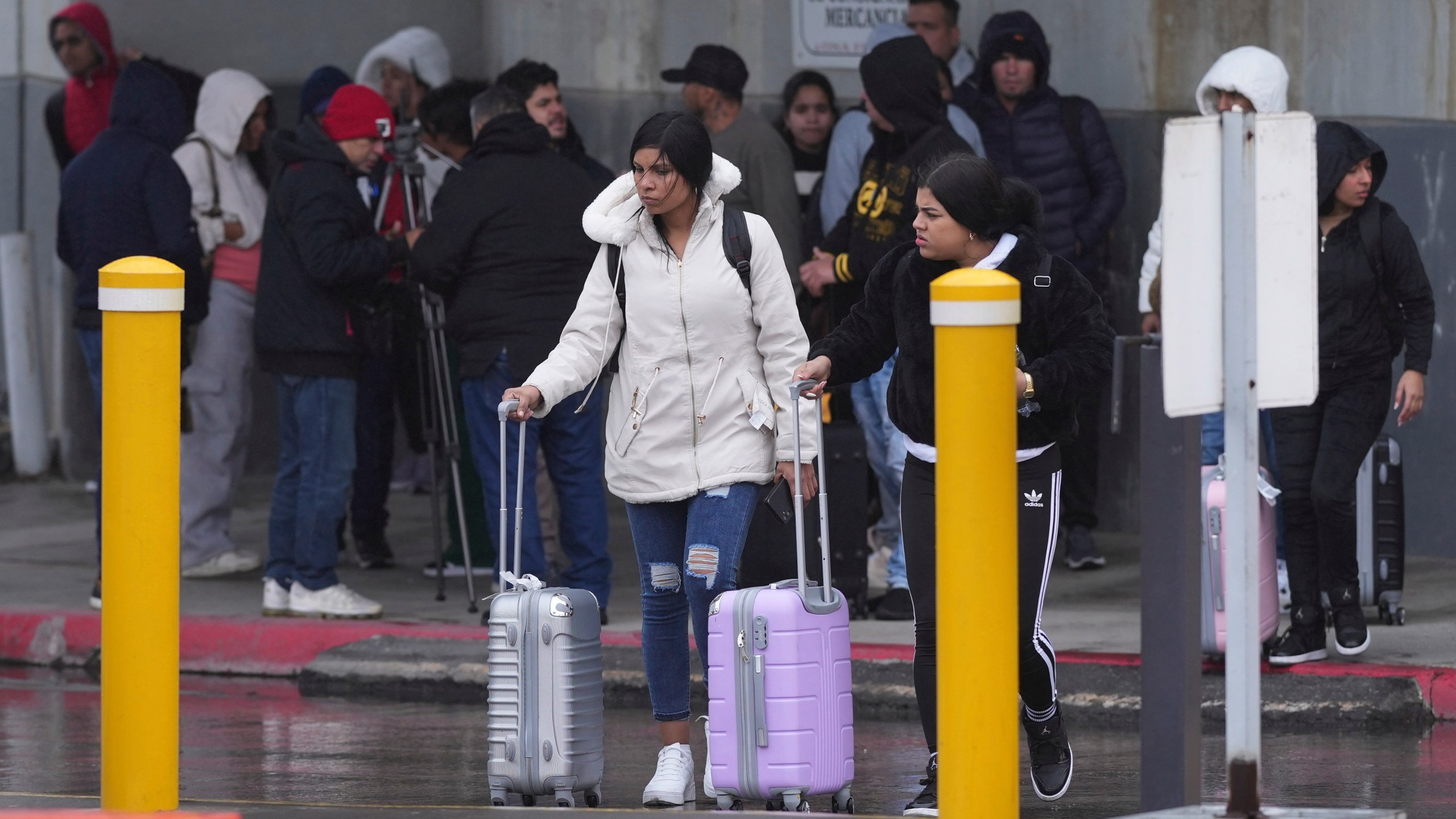 FILE - Migrants seeking asylum leave an immigration office after their scheduled meetings were canceled and they were turned away soon after President Donald Trump canceled the CBP One app, Jan. 20, 2025, in Matamoros, Mexico. (AP Photo/Eric Gay, File)