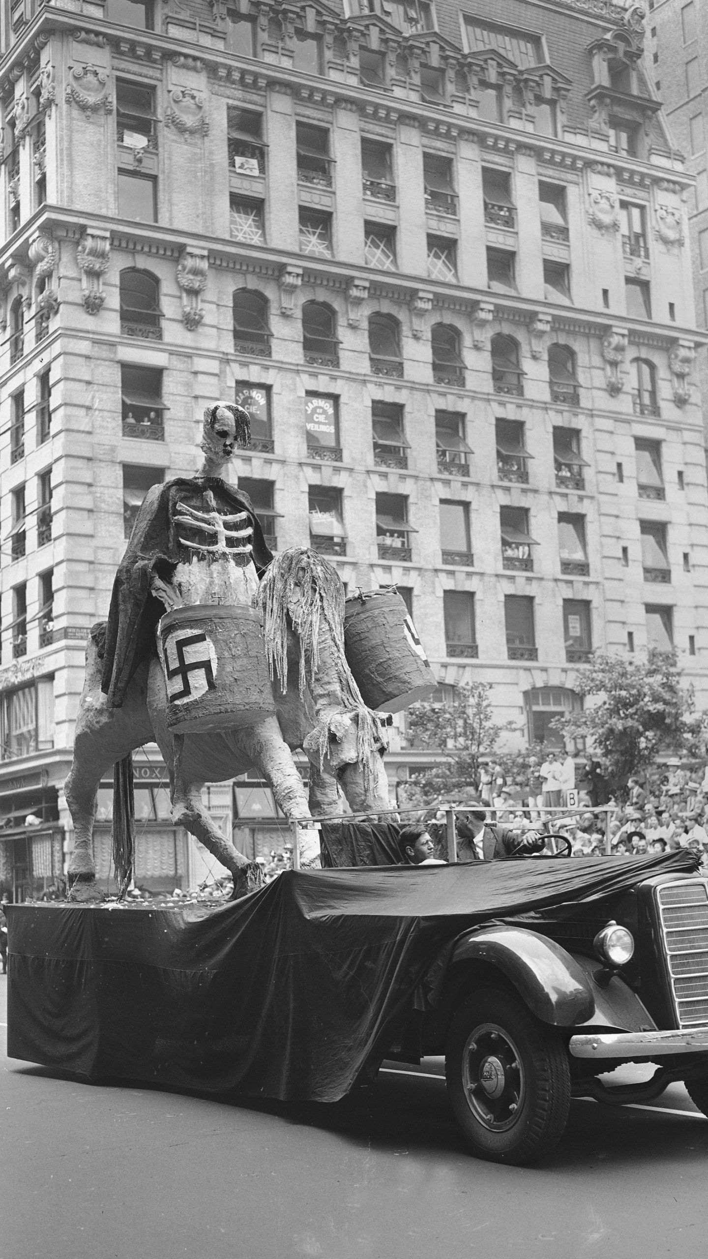 FILE - One of the floats in New York's war parade depicting Hitler in deaths' garb, rolls down Fifth Avenue in New York, June 13, 1942. (AP Photo, File)