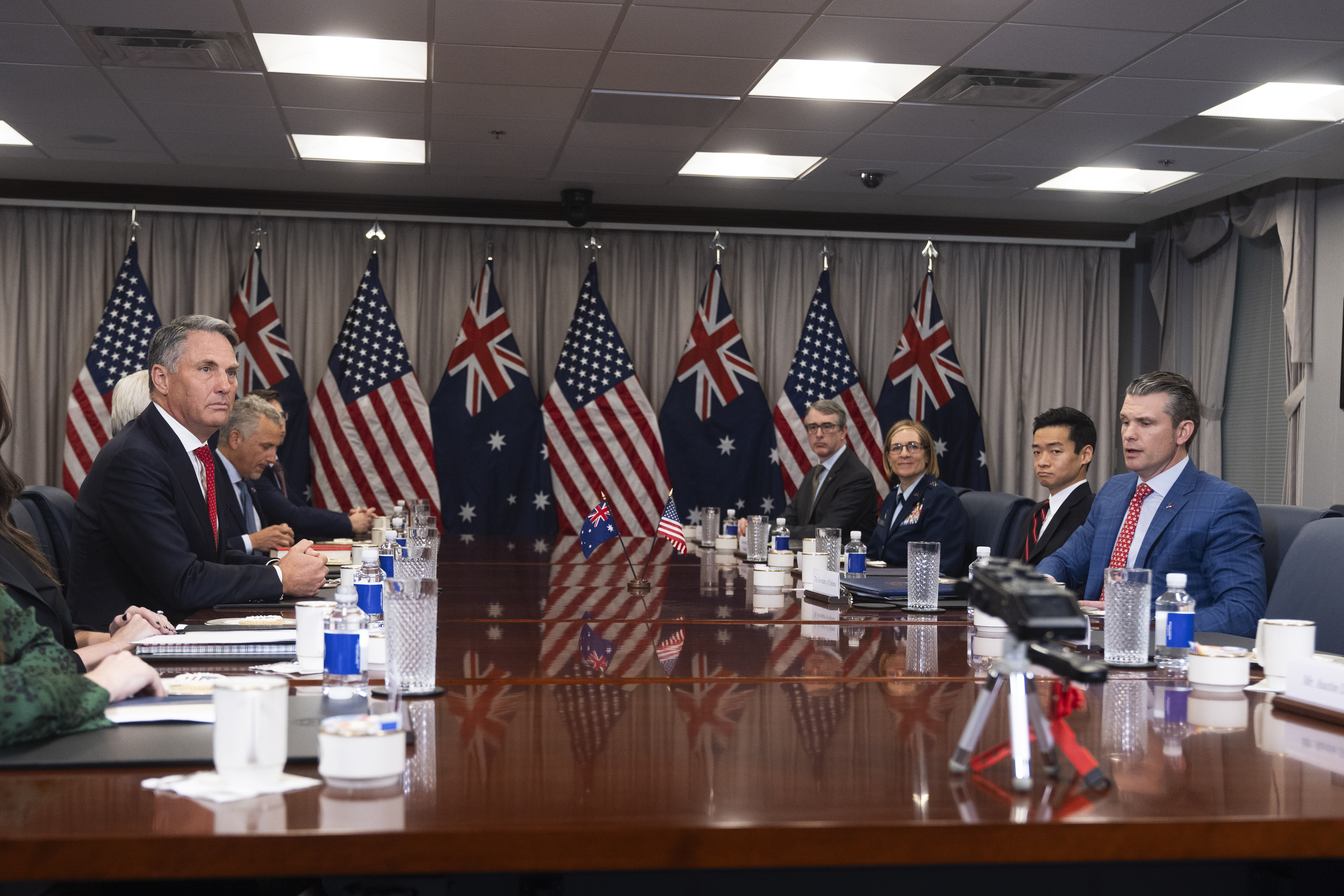 FILE - Secretary of Defense Pete Hegseth, right, welcomes Australian Deputy Prime Minister and Defense Minister Richard Marles, left, before the start of their meeting at the Pentagon, Friday, Feb. 7, 2025, in Washington. (AP Photo/Manuel Balce Ceneta, File)
