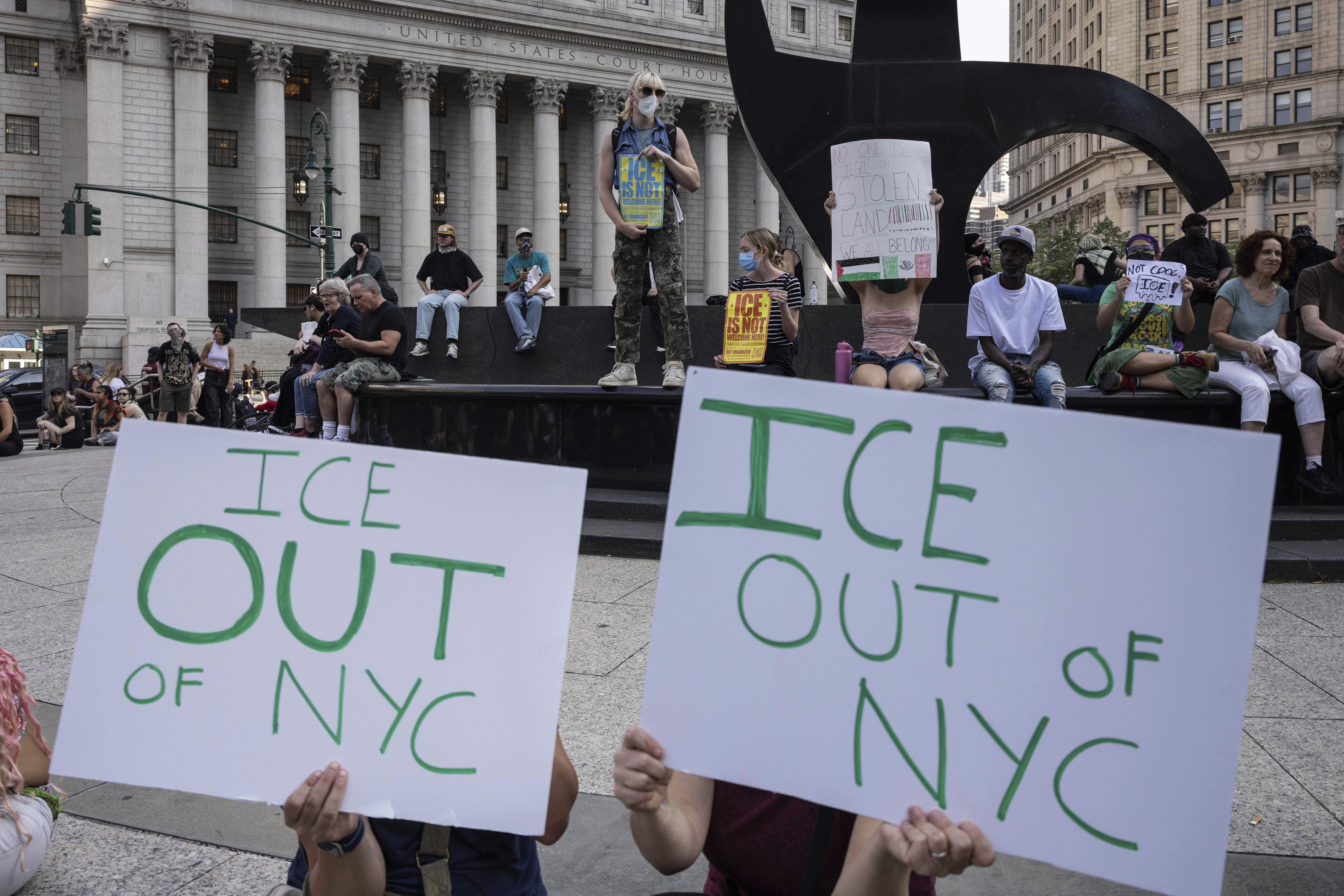 Demonstrators hold signs and chant during a protest against deportation by Immigration and Customs Enforcement in New York, Wednesday, June 11, 2025. (AP Photo/Yuki Iwamura)