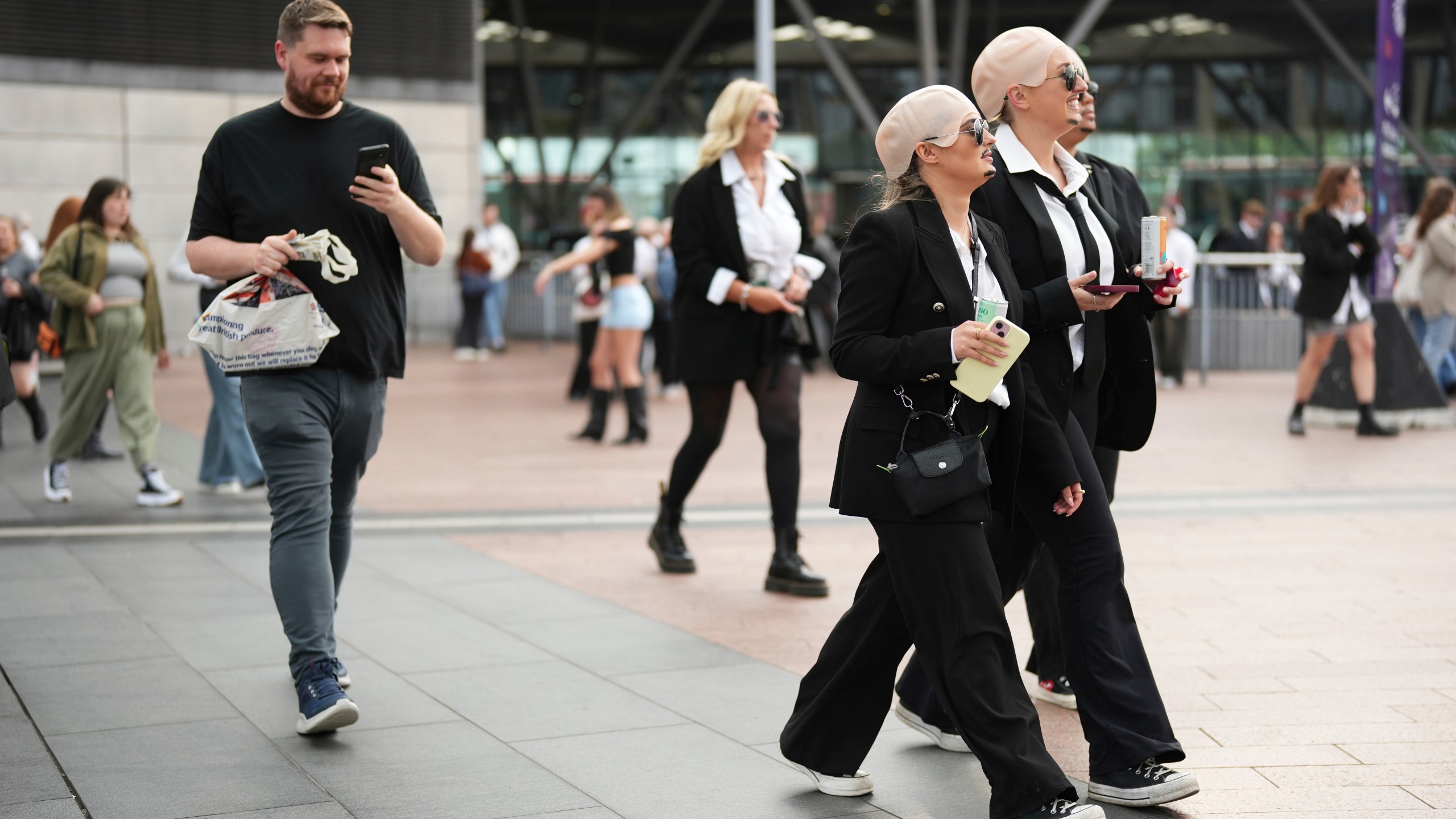 Fans exit North Greenwich Station prior to a performance by Pitbull on Monday, June 9, 2025, in London. (Photo by Scott A Garfitt/Invision/AP)