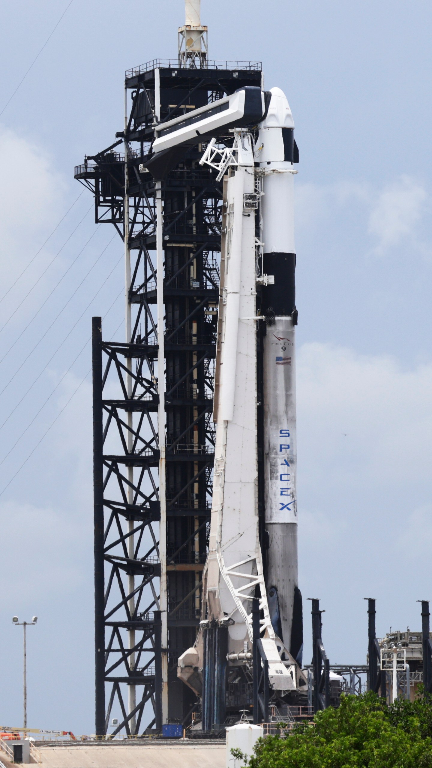 SpaceX Falcon 9 rocket with the Crew Dragon capsule stands ready for launch on pad 39A for a mission to the International Space Station at the Kennedy Space Center in Cape Canaveral, Fla., Wednesday, June 11, 2025. (AP Photo/Terry Renna)