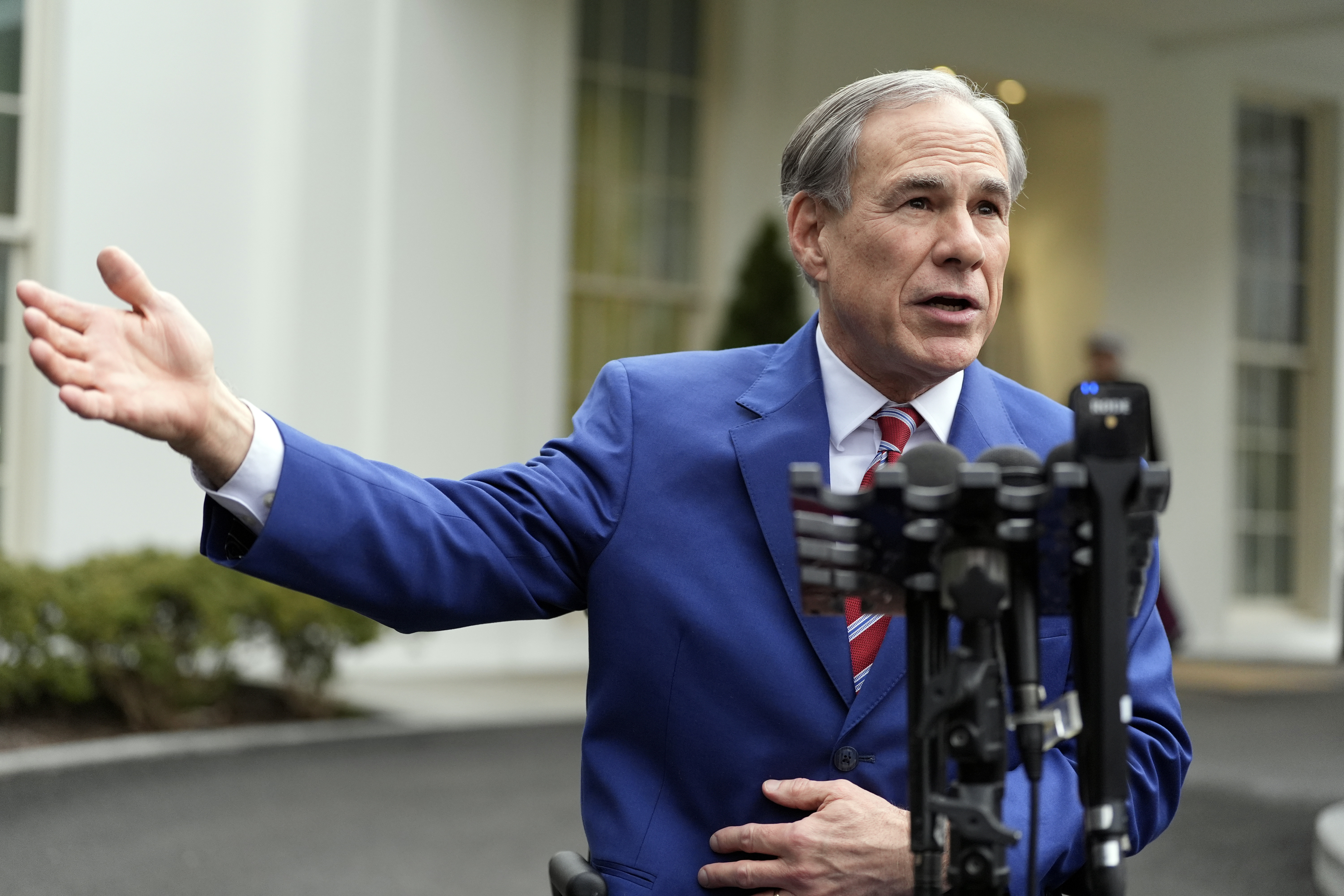 FILE - Texas Gov. Greg Abbott speaks to reporters outside the West Wing of the White House, Feb. 5, 2025, in Washington. (AP Photo/Alex Brandon, File)