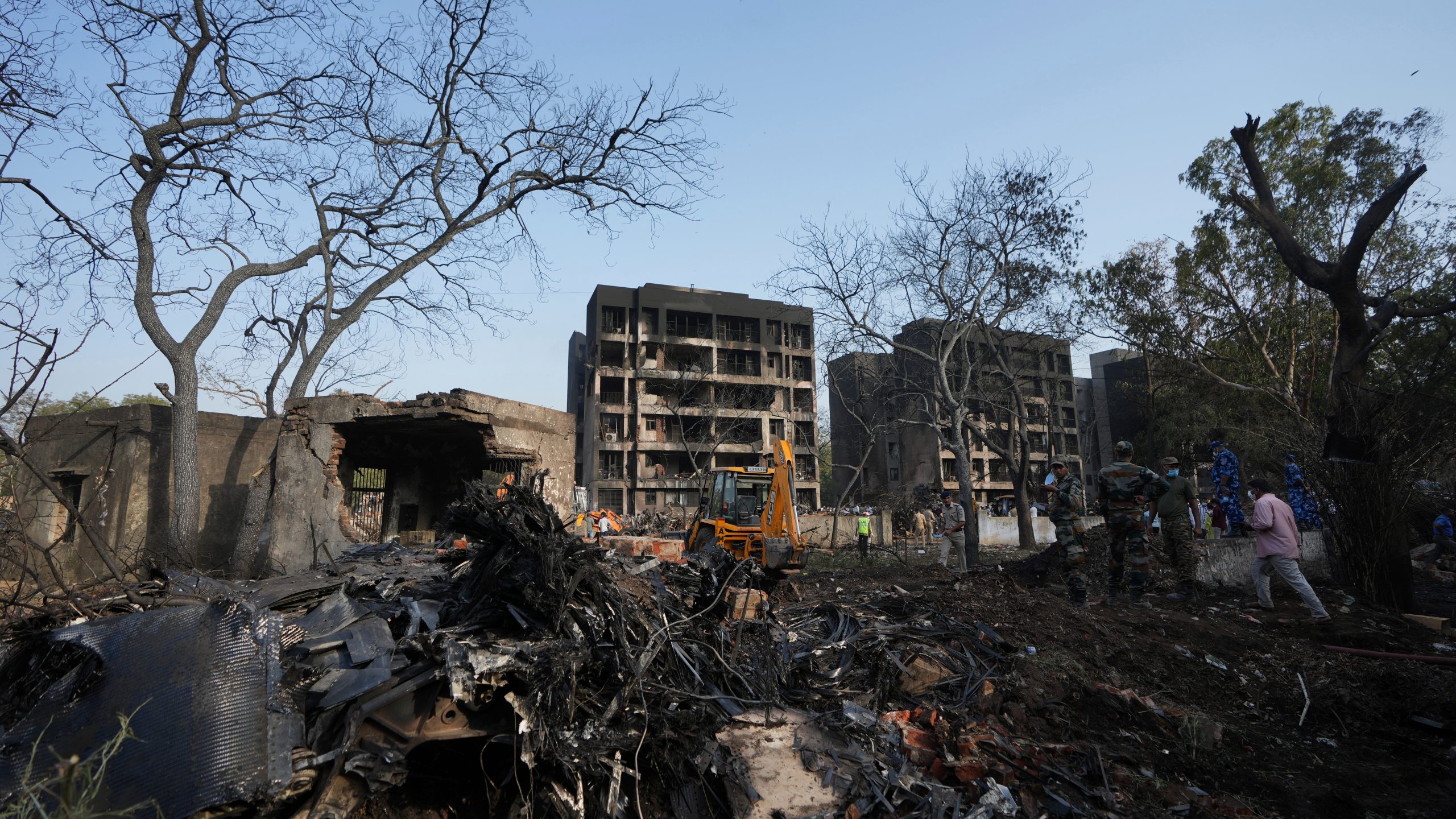 Rescuers work at the site of an airplane that crashed in India's northwestern city of Ahmedabad in Gujarat state, Thursday, June 12, 2025. (AP Photo/Ajit Solanki)