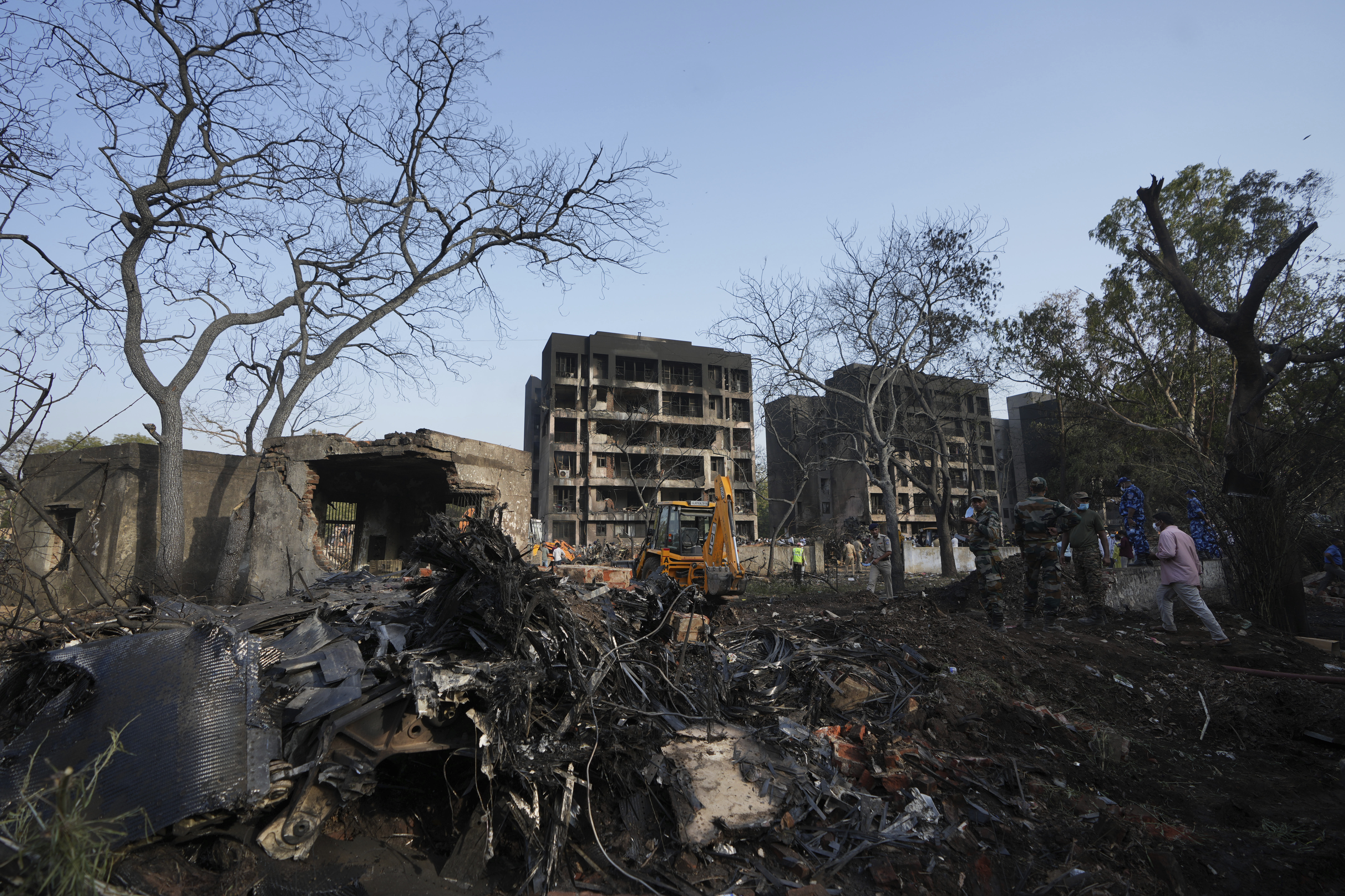 Rescuers work at the site of an airplane that crashed in India's northwestern city of Ahmedabad in Gujarat state, Thursday, June 12, 2025. (AP Photo/Ajit Solanki)