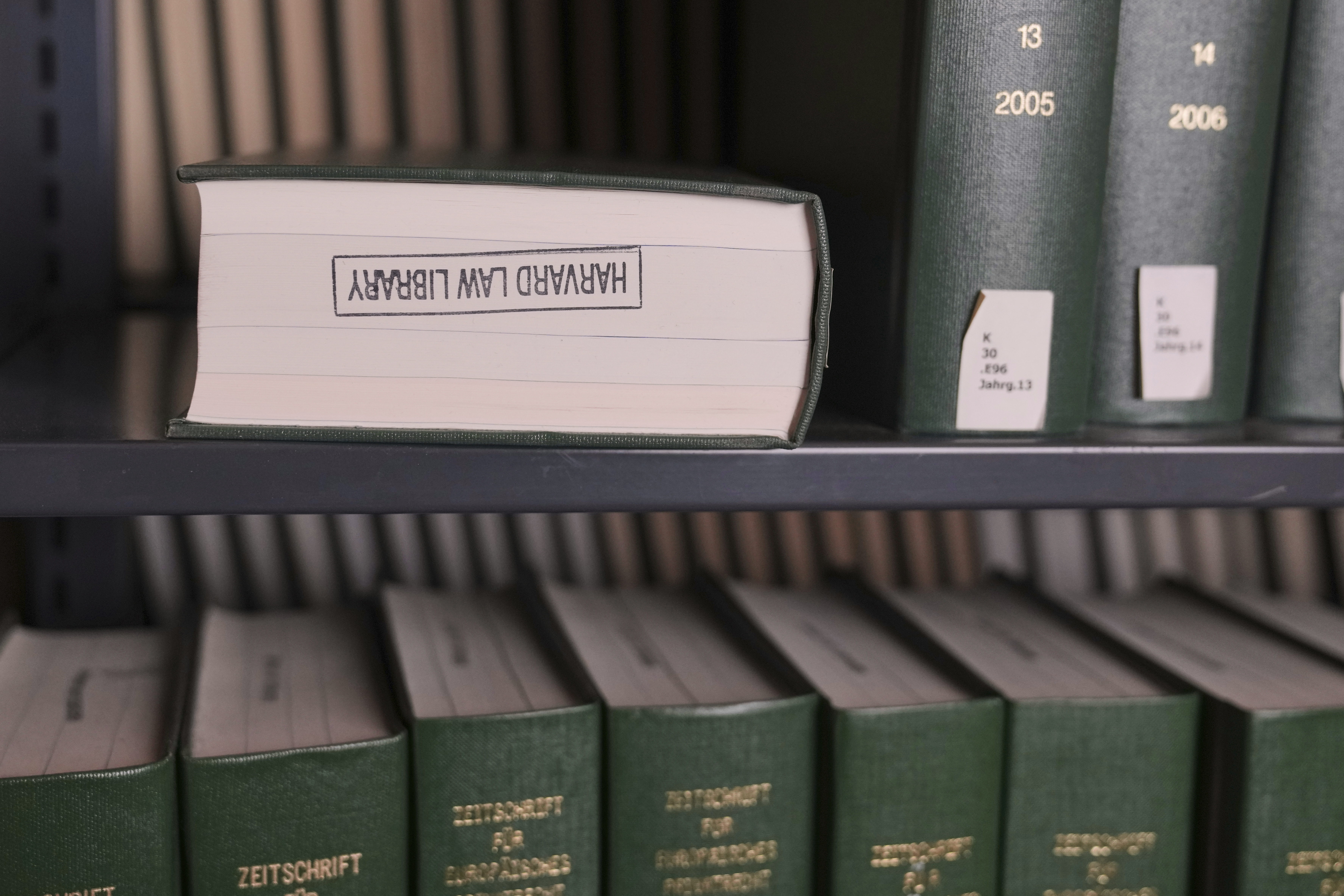 Books rest on a shelves at Langdell Hall, which houses the Harvard Law School library, Wednesday, Feb. 26, 2025, in Cambridge, Mass. (AP Photo/Charles Krupa)