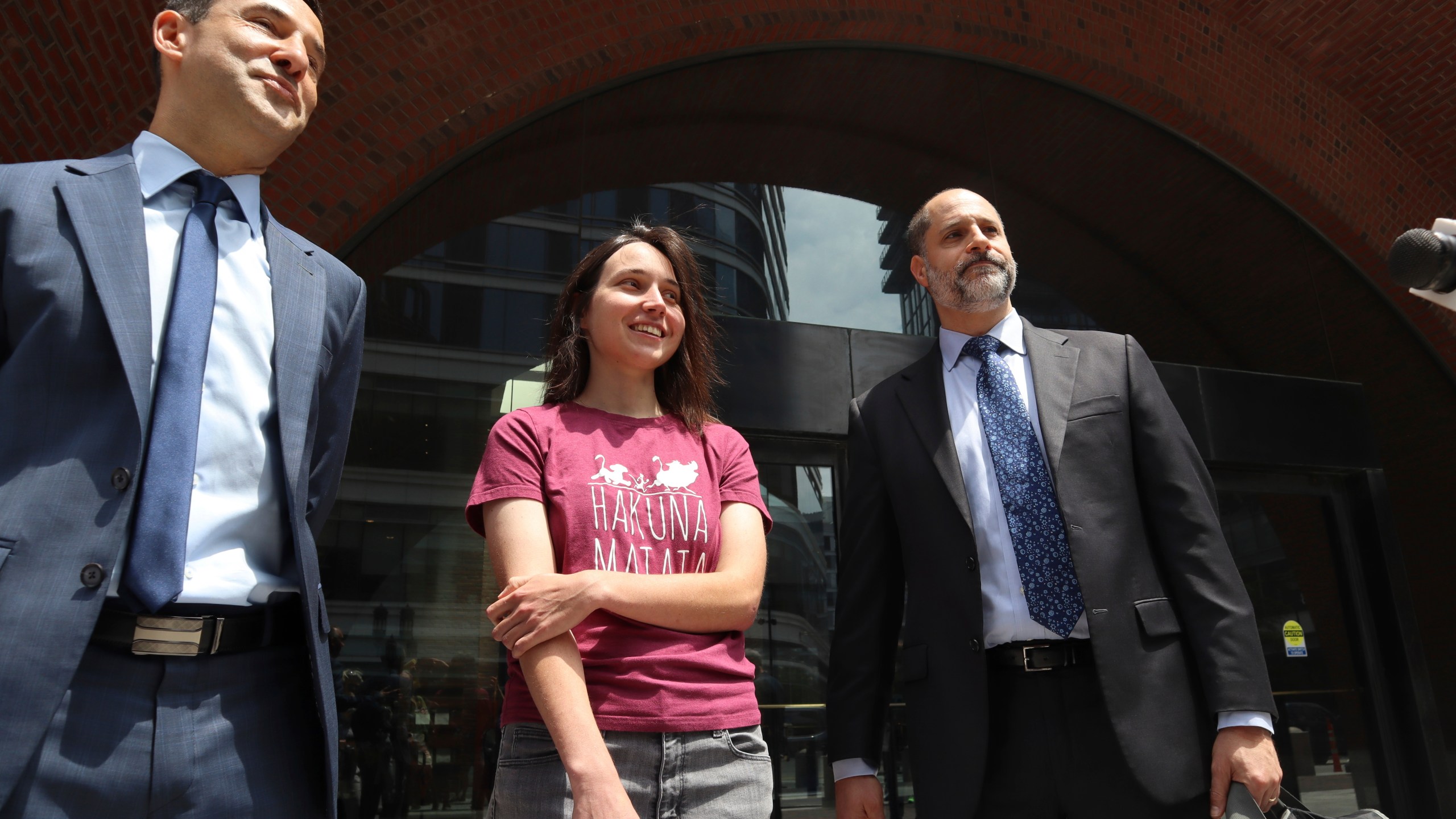 Harvard University researcherKseniia Petrova, 30, smiles next to lawyers after being released on bail from federal custody outside the John Joseph Moakley United States Courthouse on Thursday, June 12, 2025, in Boston. (AP Photo/Leah Willingham)