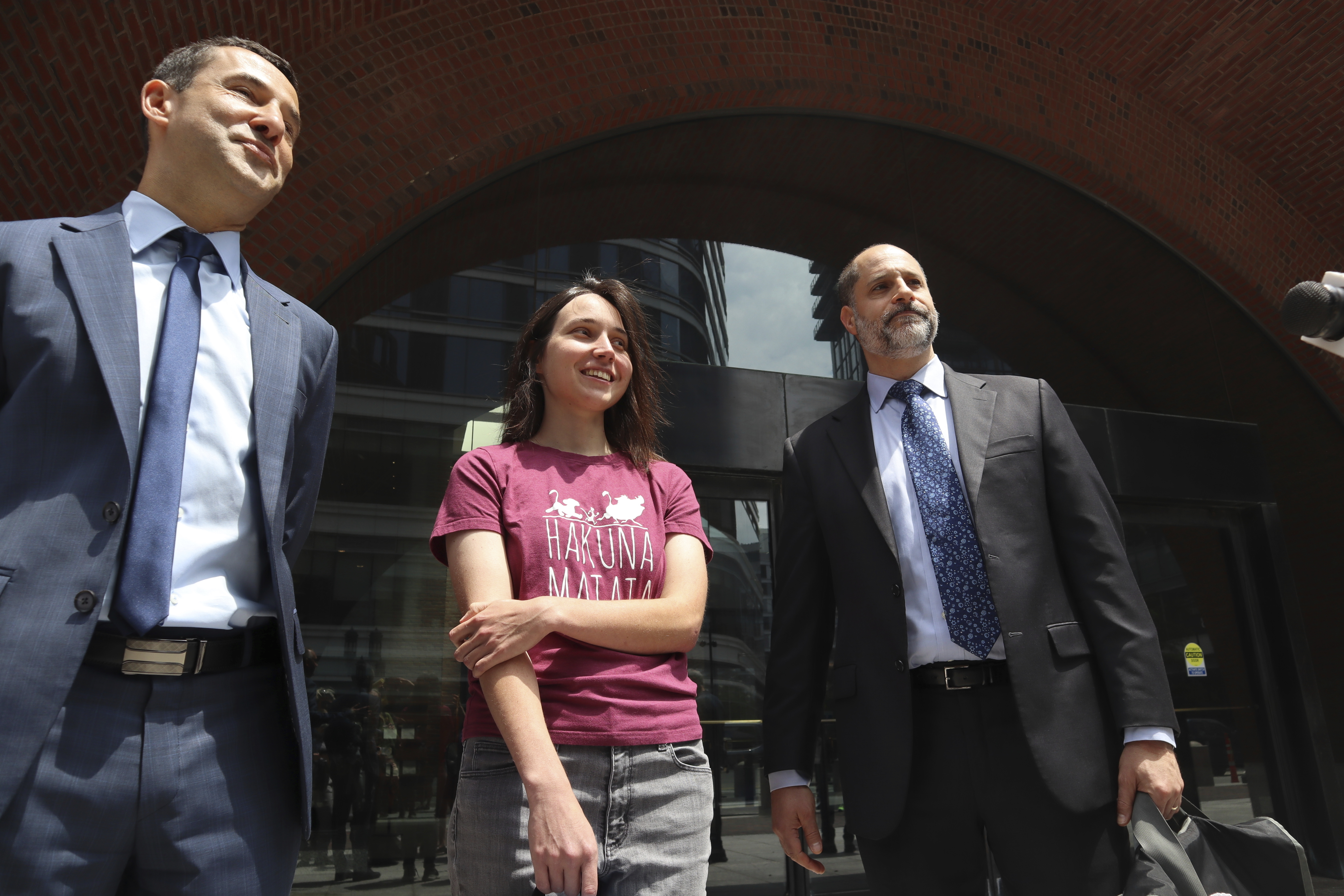 Harvard University researcherKseniia Petrova, 30, smiles next to lawyers after being released on bail from federal custody outside the John Joseph Moakley United States Courthouse on Thursday, June 12, 2025, in Boston. (AP Photo/Leah Willingham)
