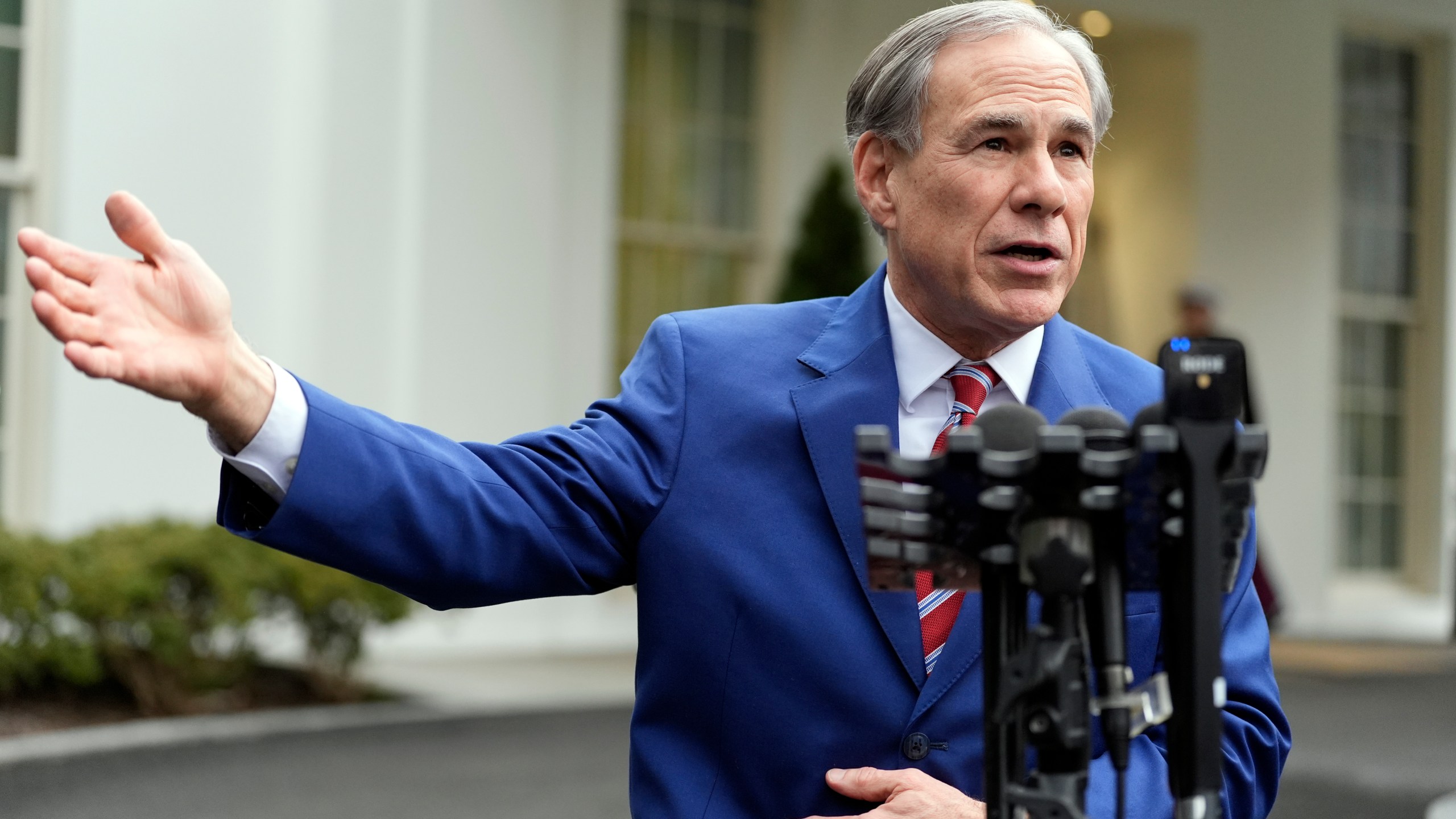 FILE - Texas Gov. Greg Abbott speaks to reporters outside the West Wing of the White House, Feb. 5, 2025, in Washington. (AP Photo/Alex Brandon, File)