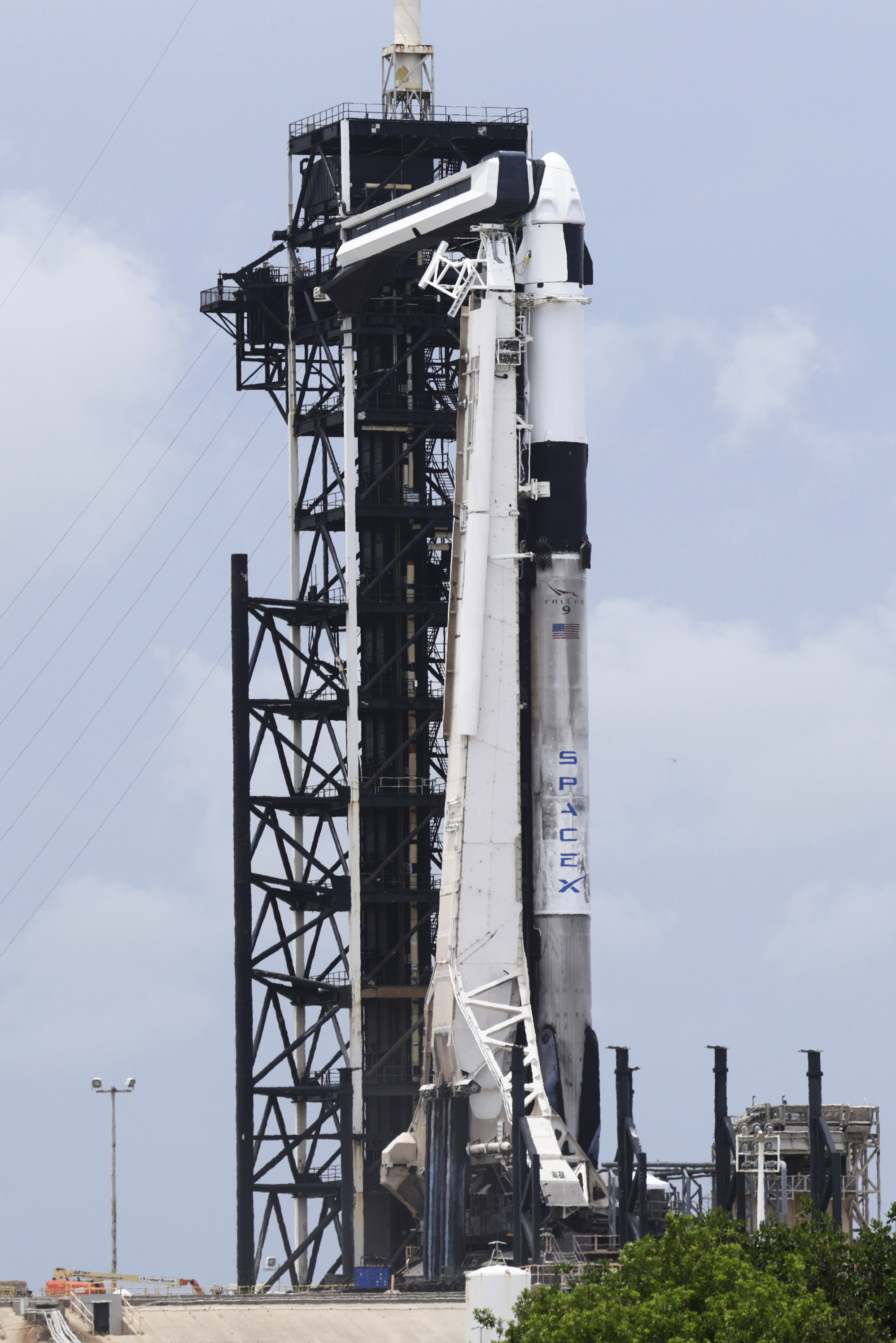 SpaceX Falcon 9 rocket with the Crew Dragon capsule stands ready for launch on pad 39A for a mission to the International Space Station at the Kennedy Space Center in Cape Canaveral, Fla., Wednesday, June 11, 2025. (AP Photo/Terry Renna)