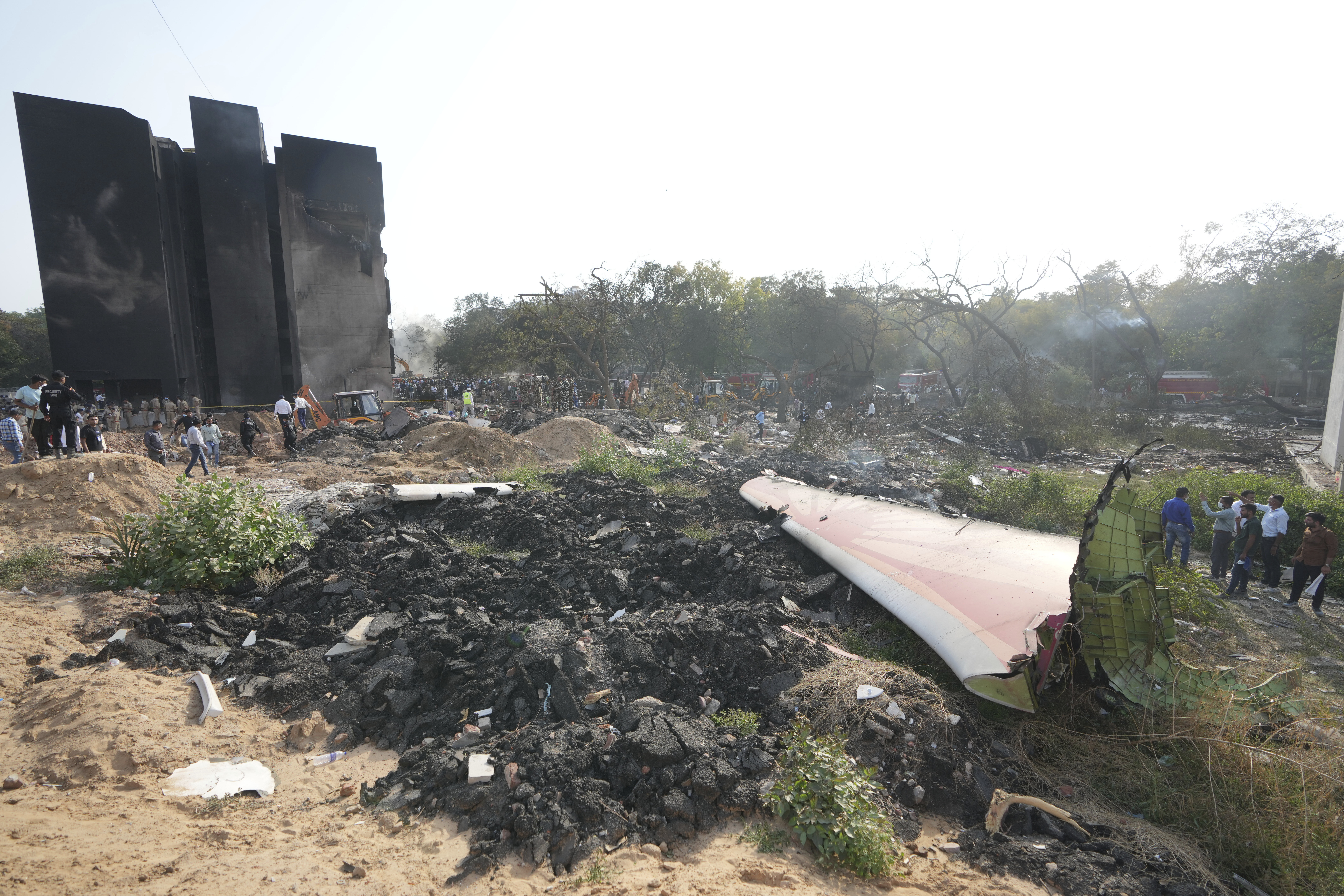 The debris of an airplane lie scattered after it crashed in India's northwestern city of Ahmedabad in Gujarat state, Thursday, June 12, 2025. (AP Photo/Ajit Solanki)