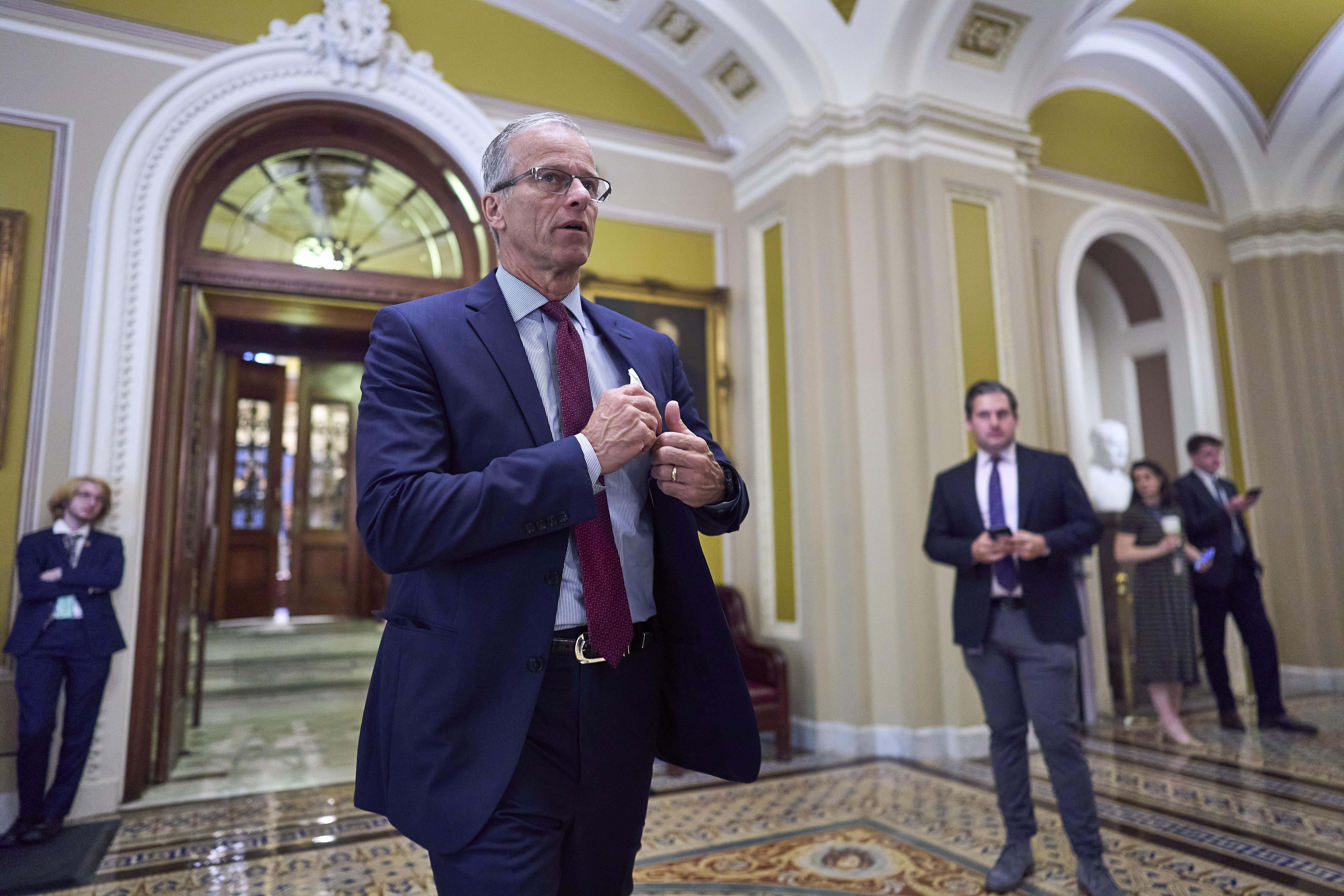 Senate Majority Leader John Thune, R-S.D., leaves the chamber as Republican senators meet to find a way to help President Donald Trump cancel $9.4 billion in spending already approved by Congress, at the Capitol in Washington, Wednesday, June 11, 2025. (AP Photo/J. Scott Applewhite)