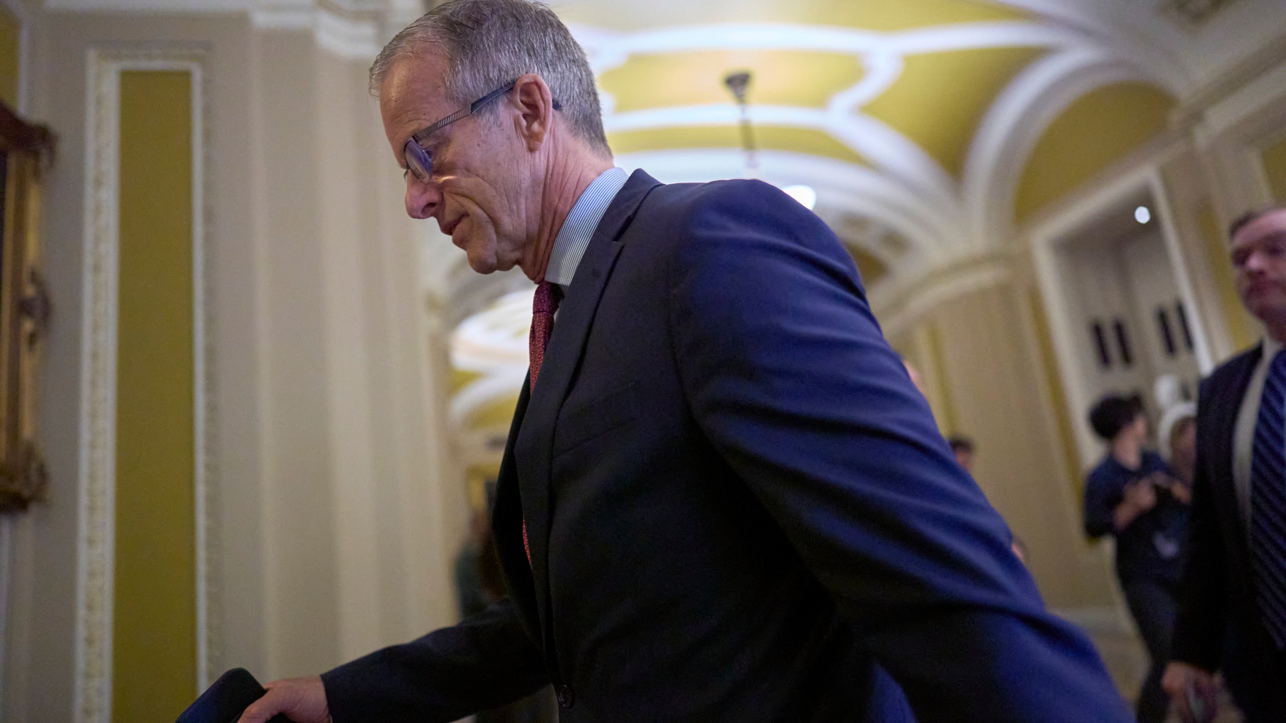 Senate Majority Leader John Thune, R-S.D., arrives at the chamber as Republican senators meet to find a way to help President Donald Trump cancel $9.4 billion in spending already approved by Congress, at the Capitol in Washington, Wednesday, June 11, 2025. (AP Photo/J. Scott Applewhite)
