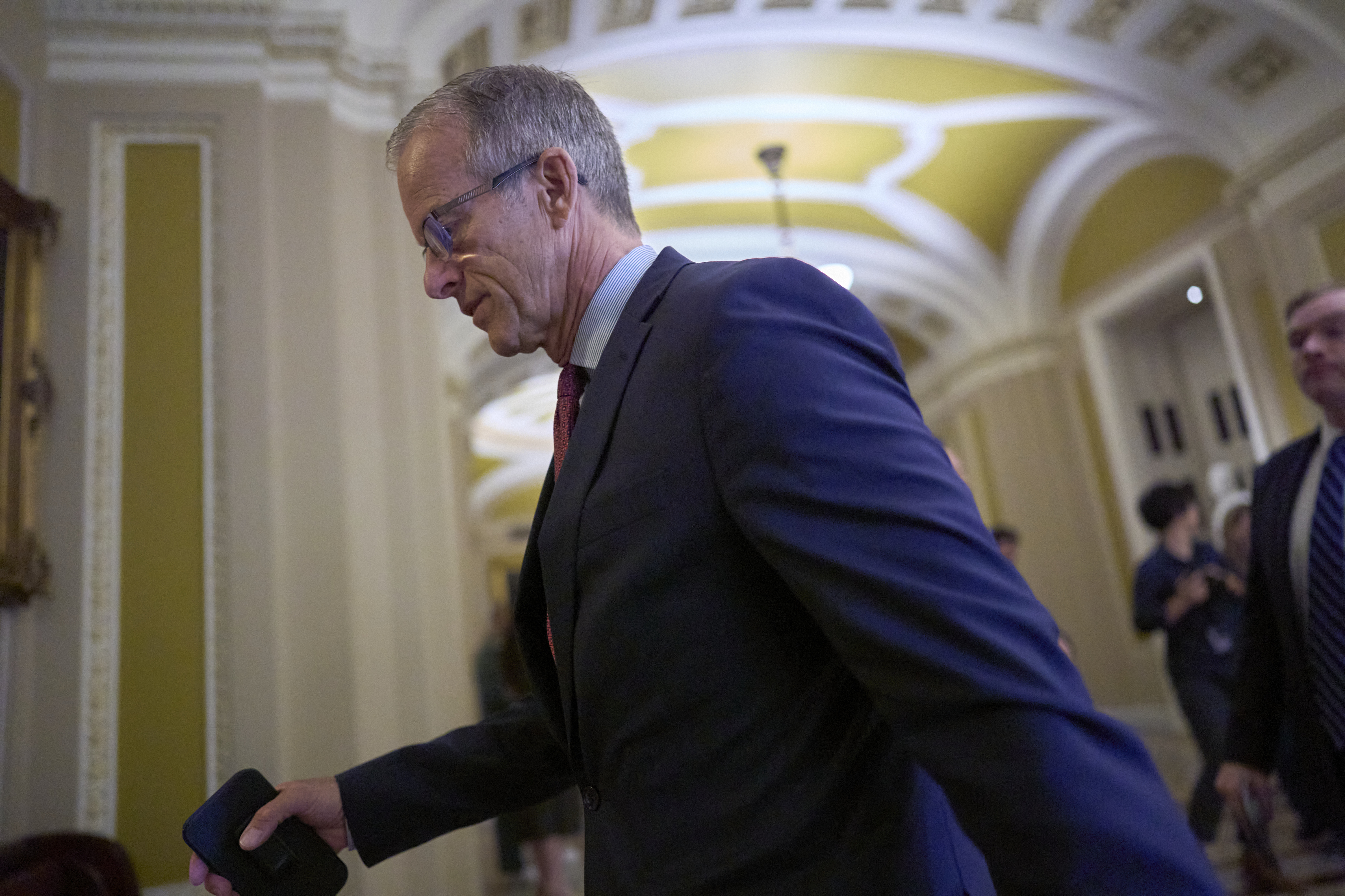 Senate Majority Leader John Thune, R-S.D., arrives at the chamber as Republican senators meet to find a way to help President Donald Trump cancel $9.4 billion in spending already approved by Congress, at the Capitol in Washington, Wednesday, June 11, 2025. (AP Photo/J. Scott Applewhite)