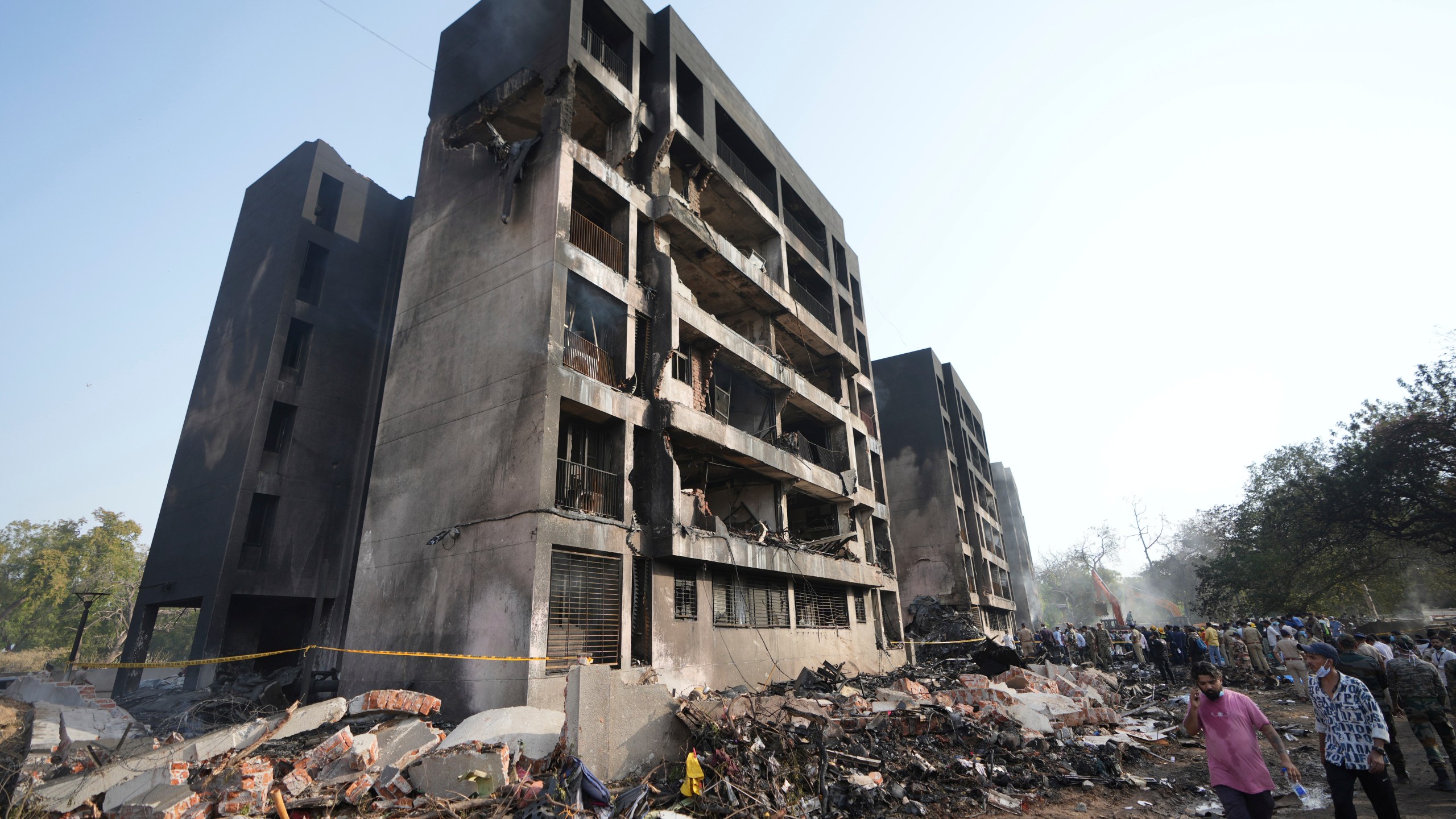 Search and rescue teams respond to the scene of a plane crash in Ahmedabad, India, Thursday, June 12, 2025. (AP Photo/Ajit Solanki)