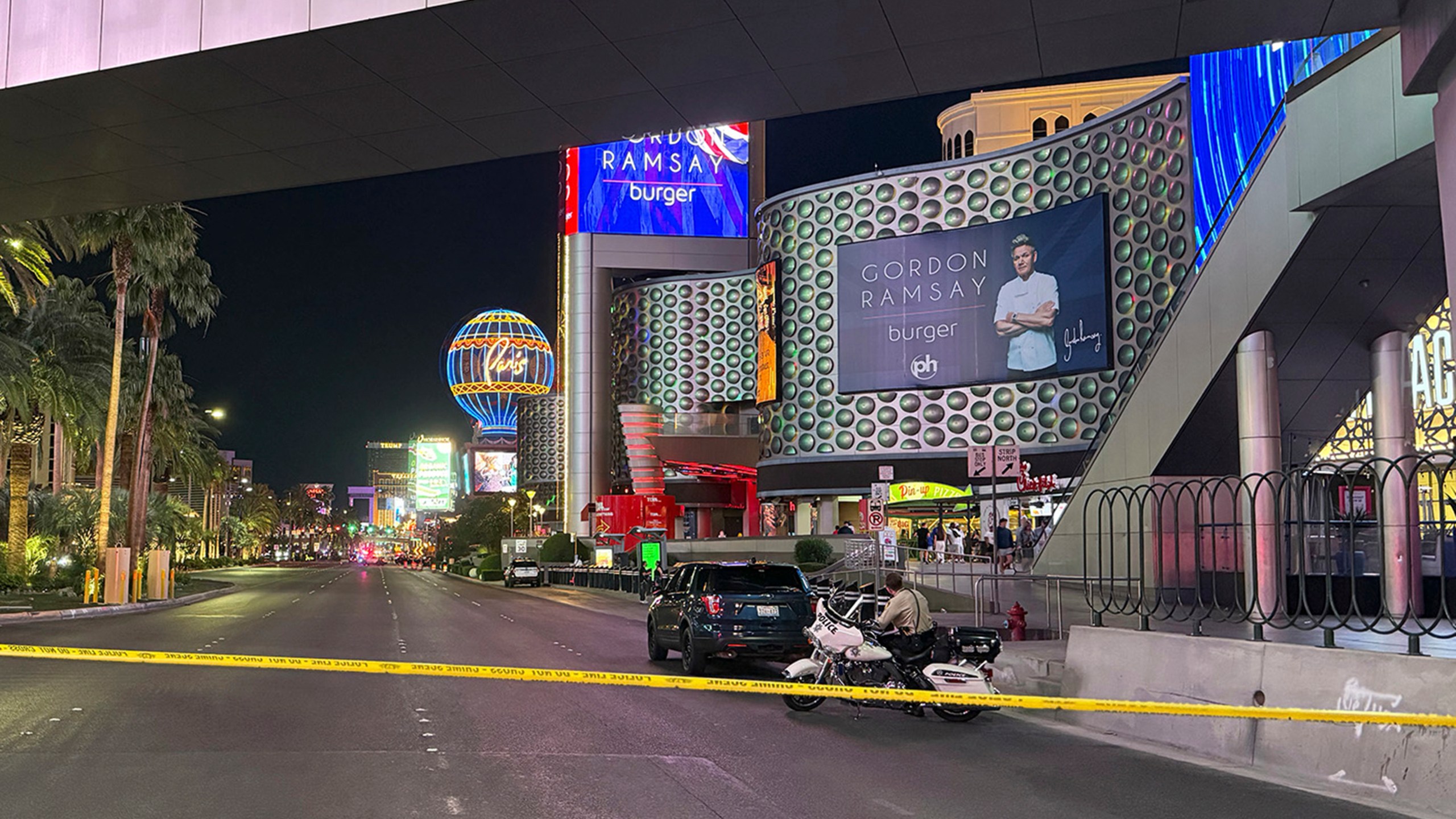 Las Vegas Metropolitan Police officers investigate the scene of a shooting on the Strip that left two dead Monday, June 9, 2025, in Las Vegas. (Madeline Carter/Las Vegas Review-Journal via AP)