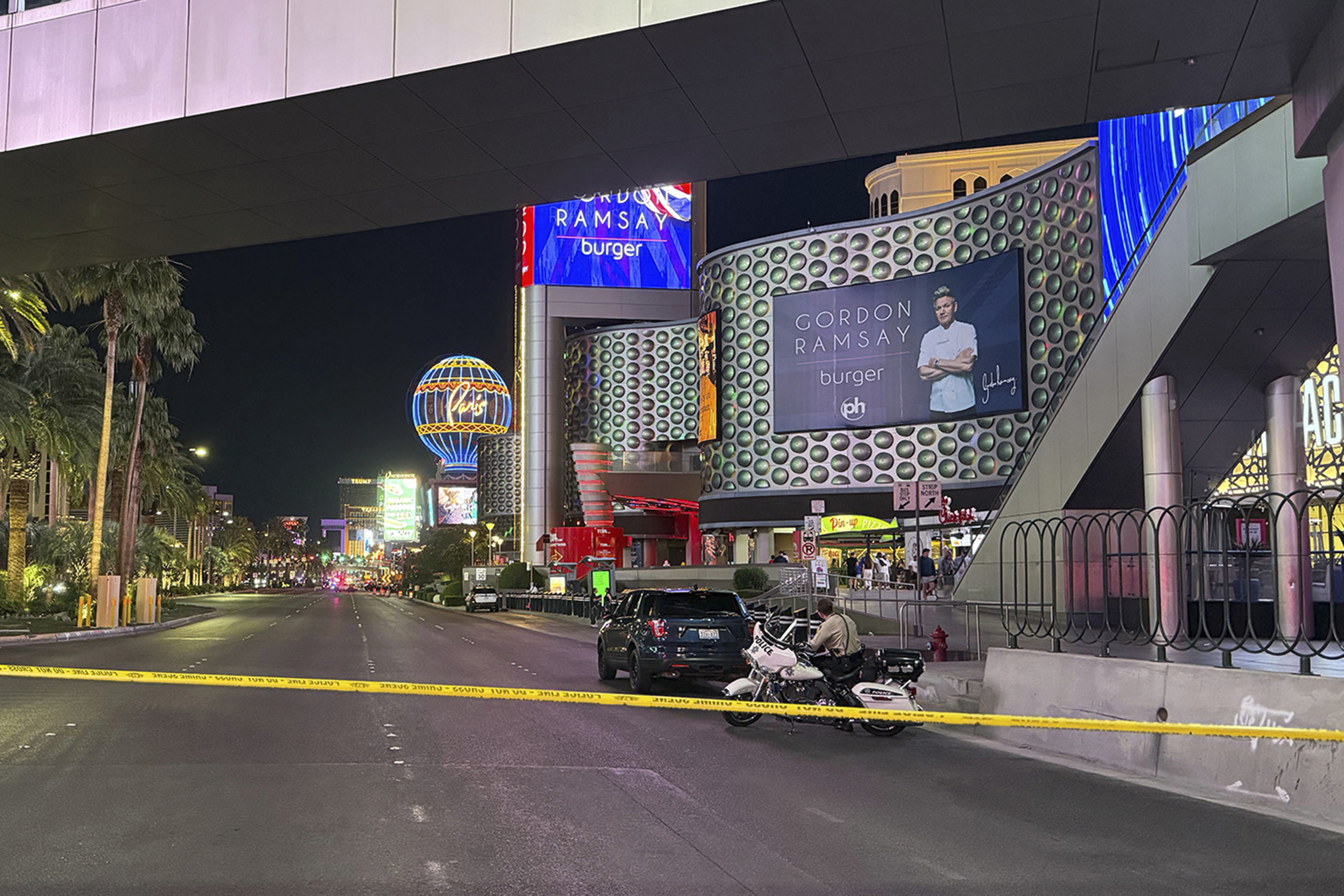 Las Vegas Metropolitan Police officers investigate the scene of a shooting on the Strip that left two dead Monday, June 9, 2025, in Las Vegas. (Madeline Carter/Las Vegas Review-Journal via AP)