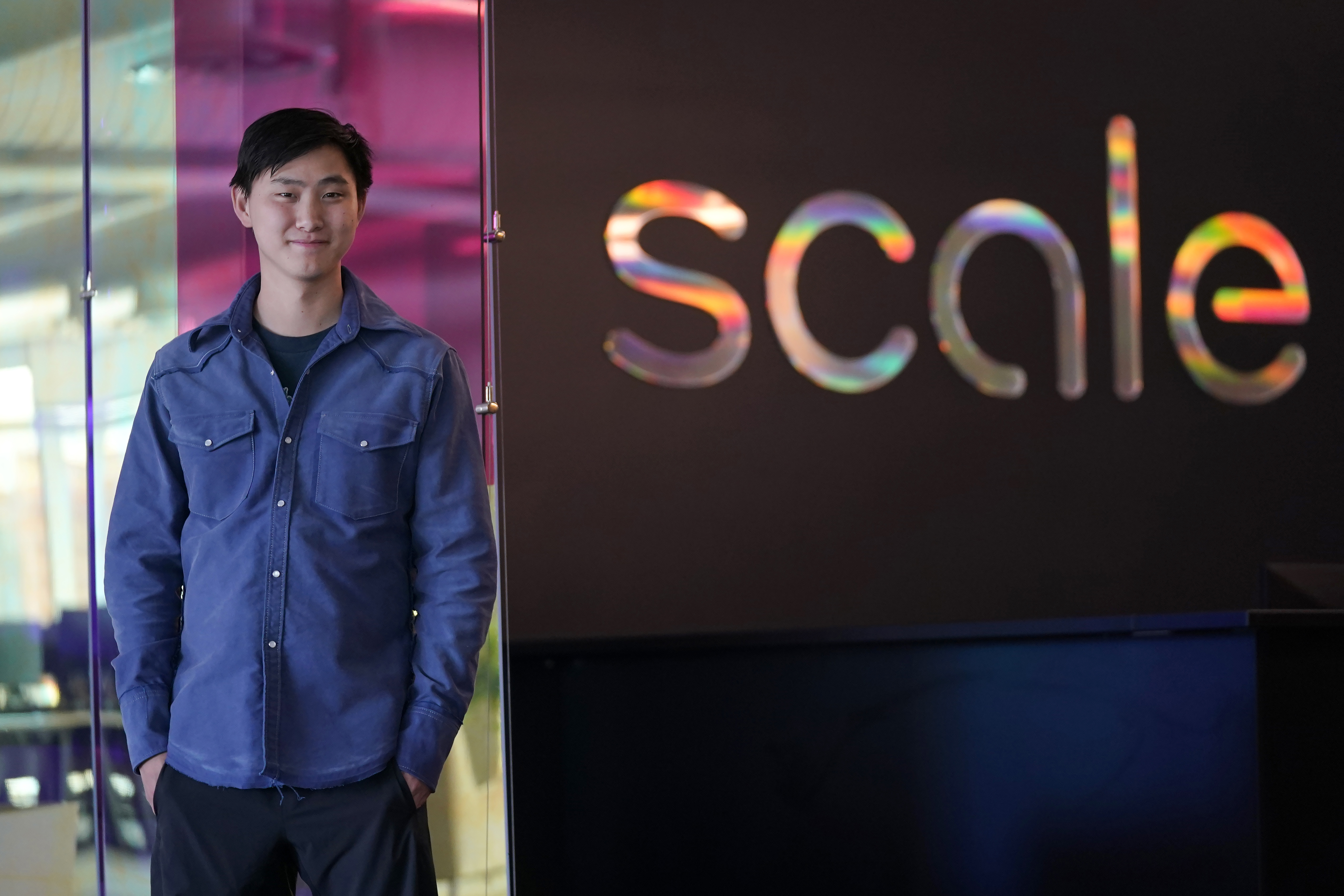 FILE - Scale AI founder and CEO Alexandr Wang poses for photos at the company's office in San Francisco, May 15, 2023. (AP Photo/Jeff Chiu, File)