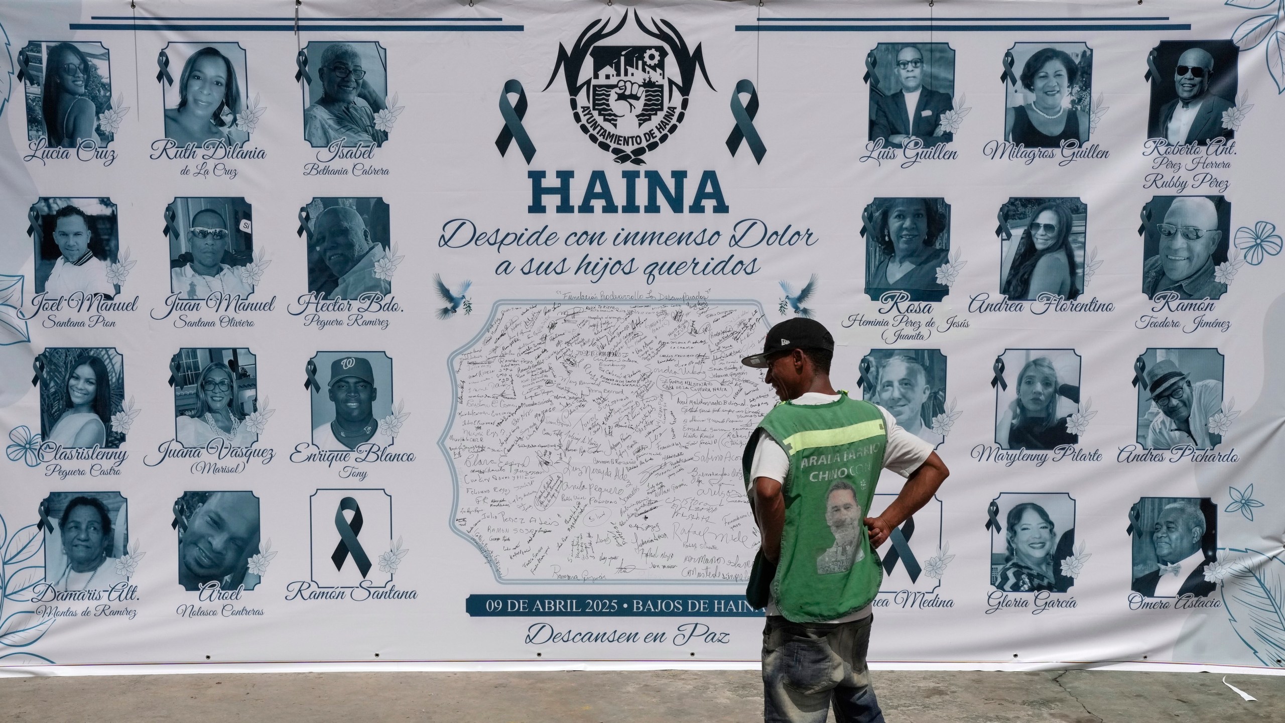 FILE - A banner with images of some of the victims of the Jet Set nightclub roof collapse that killed more than 200 people, is displayed on a facade in Haina, Dominican Republic, April 10, 2025. (AP Photo/Matias Delacroix, File)