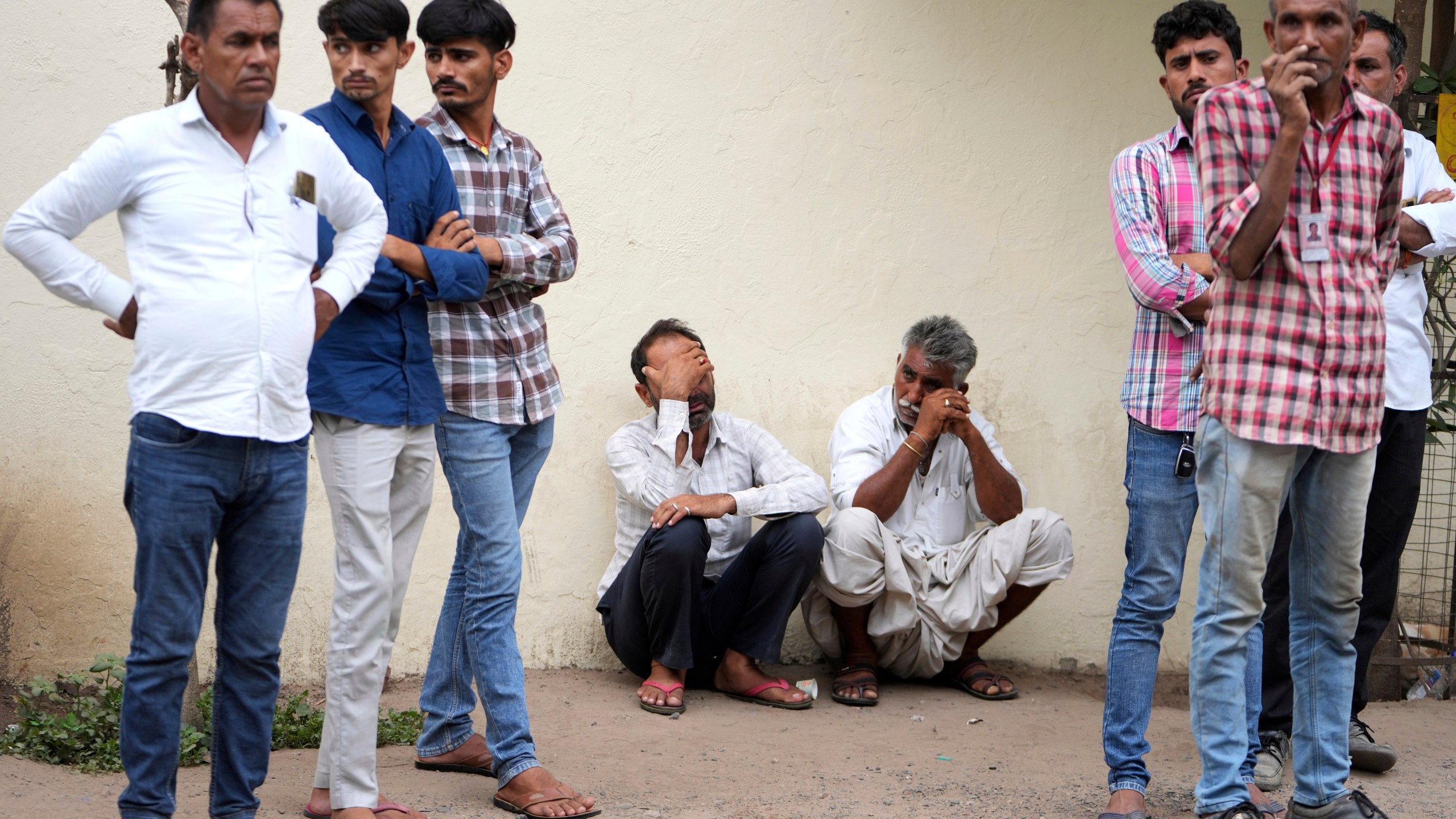 Family members wait at a hospital for the body of a relative killed in an airplane crash on Thursday in Ahmedabad, India, Friday, June 13, 2025. (AP Photo/Ajit Solanki)