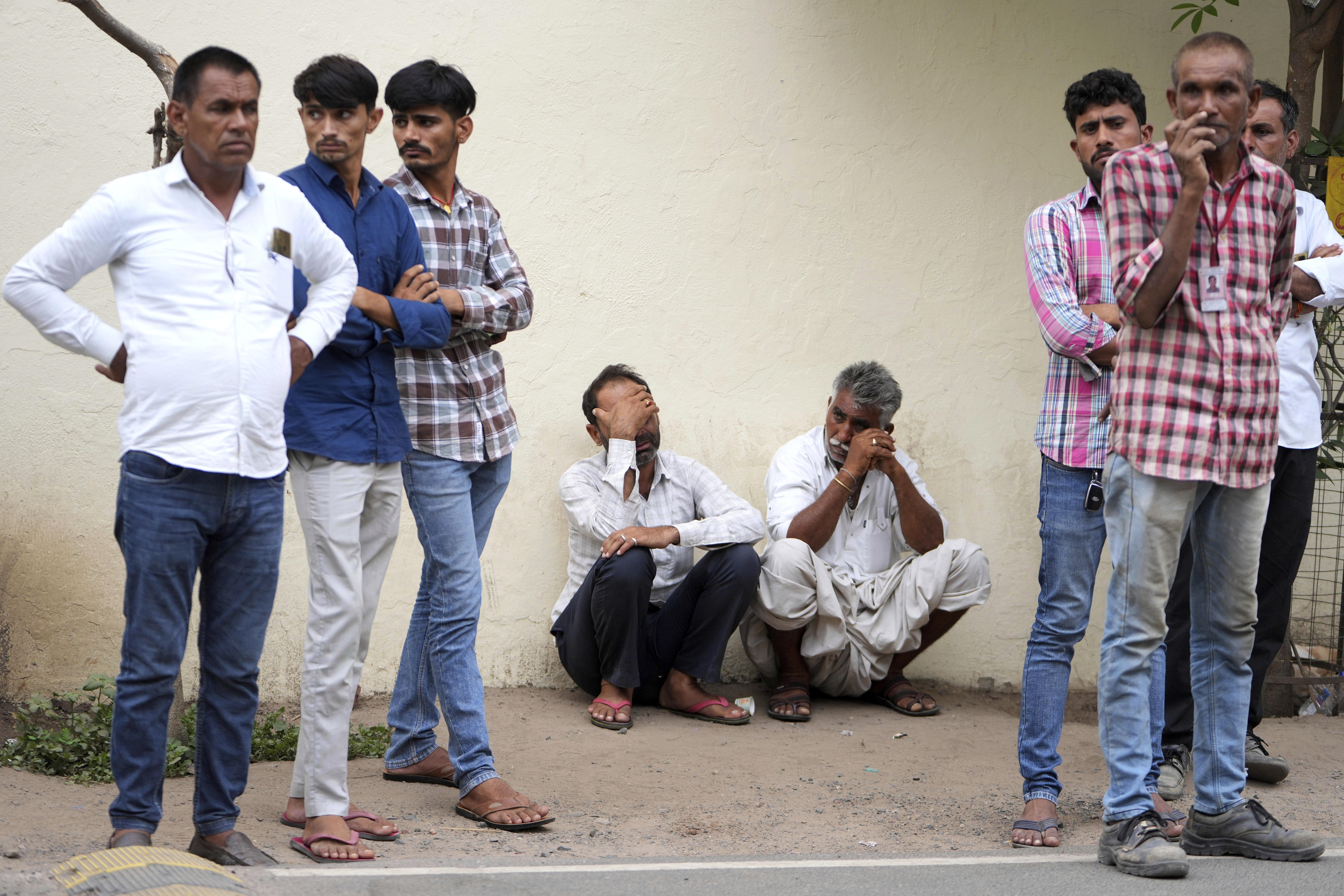 Family members wait at a hospital for the body of a relative killed in an airplane crash on Thursday in Ahmedabad, India, Friday, June 13, 2025. (AP Photo/Ajit Solanki)