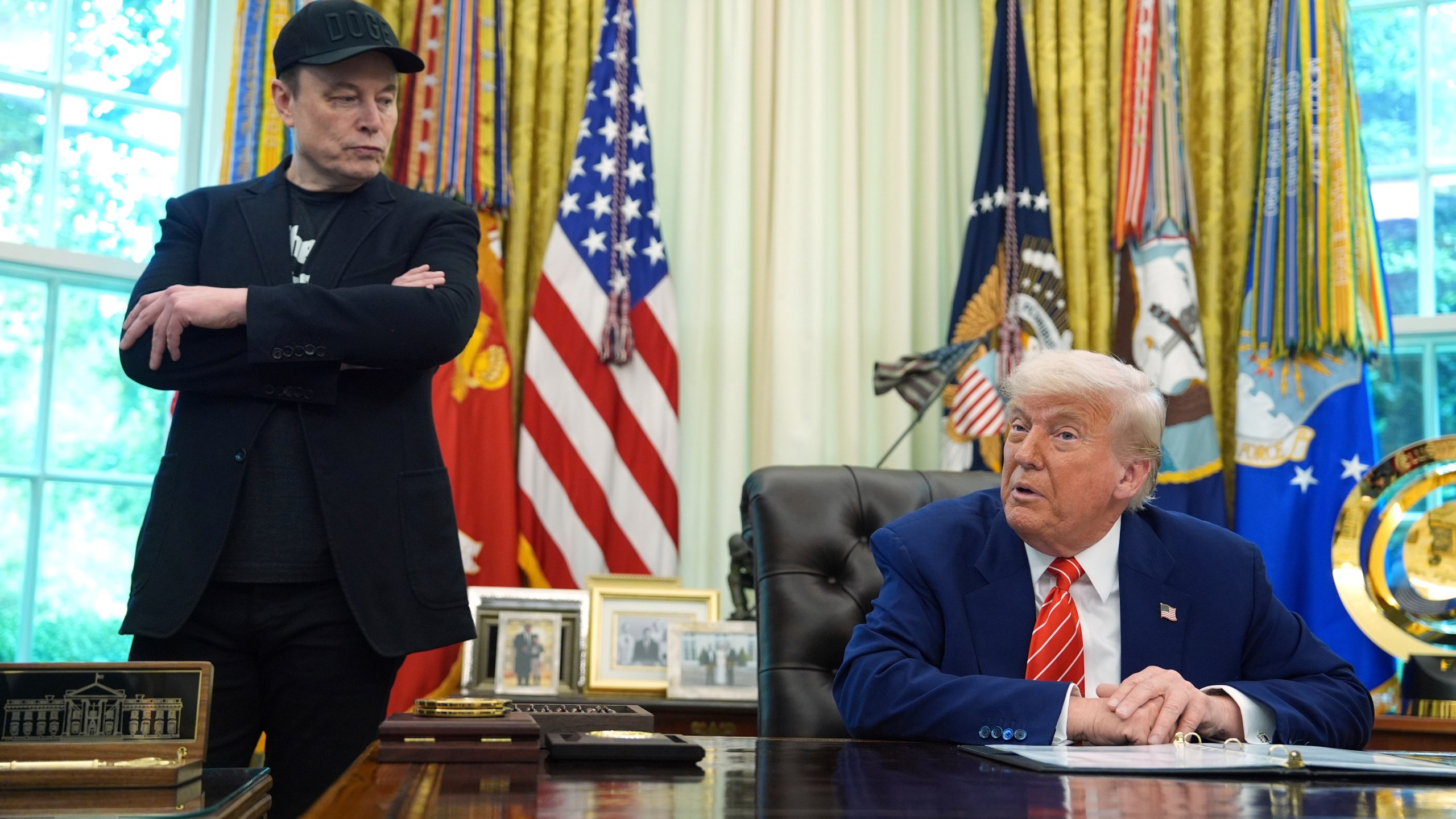 FILE - President Donald Trump, right, speaks during a news conference with Elon Musk in the Oval Office of the White House, Friday, May 30, 2025, in Washington. (AP Photo/Evan Vucci, File)