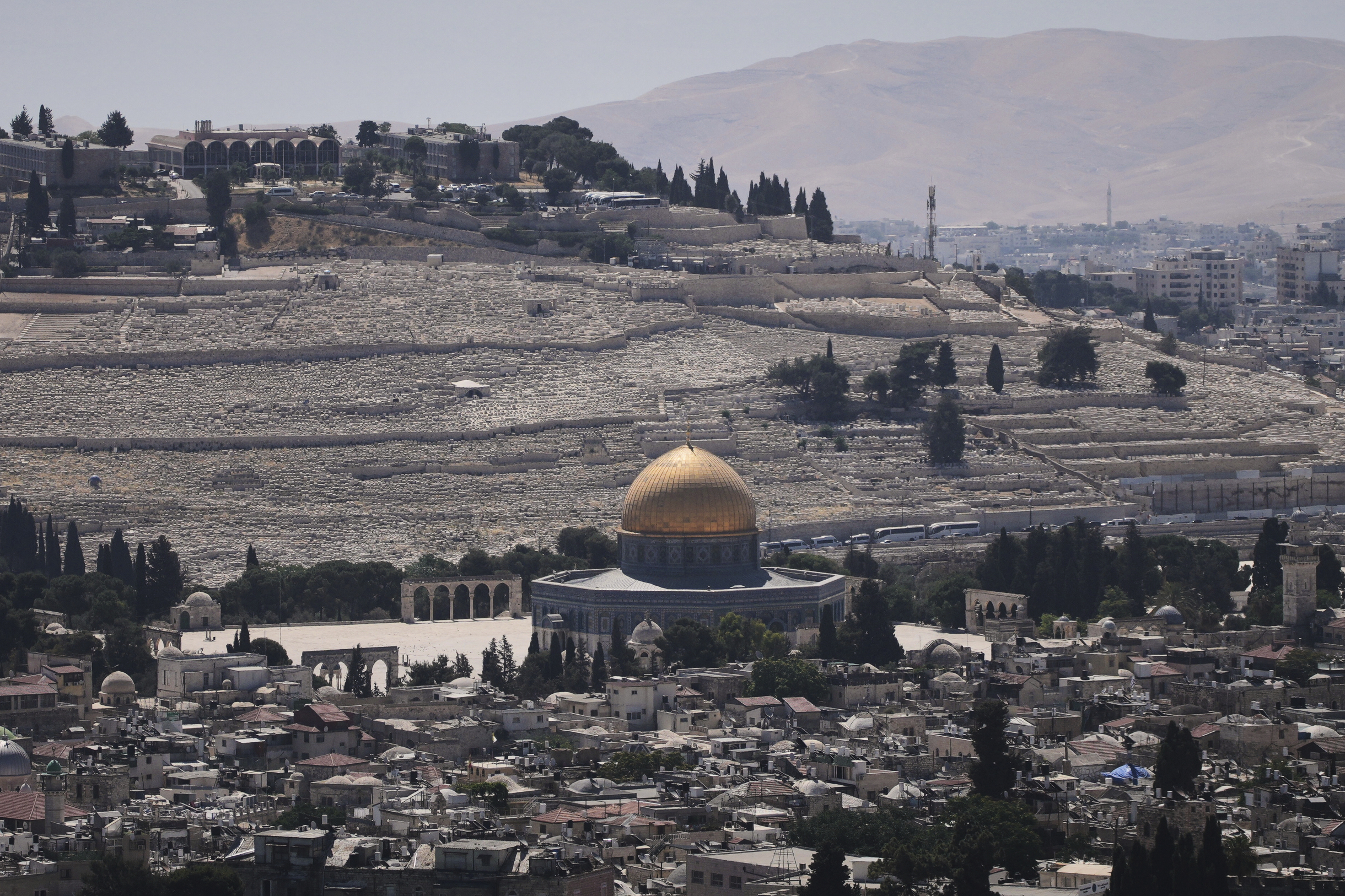 A view of Jerusalem's Old City, with the Dome of the Rock shrine in the Al-Aqsa Mosque compound, closed to worshippers after Israel's Homefront Command banned public gatherings following an Israeli military strike on Iran, Friday, June 13, 2025. (AP Photo/Ohad Zwigenberg)