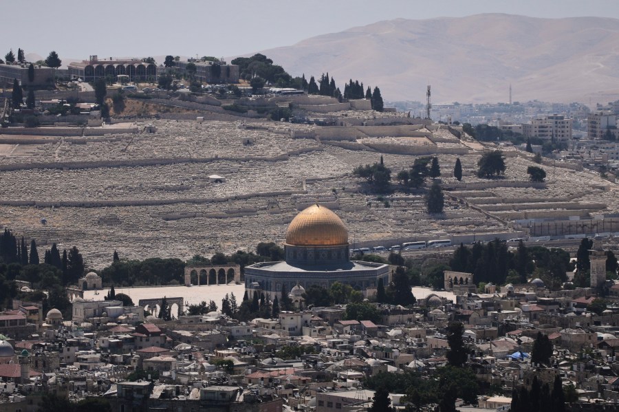 A view of Jerusalem's Old City, with the Dome of the Rock shrine in the Al-Aqsa Mosque compound, closed to worshippers after Israel's Homefront Command banned public gatherings following an Israeli military strike on Iran, Friday, June 13, 2025. (AP Photo/Ohad Zwigenberg)