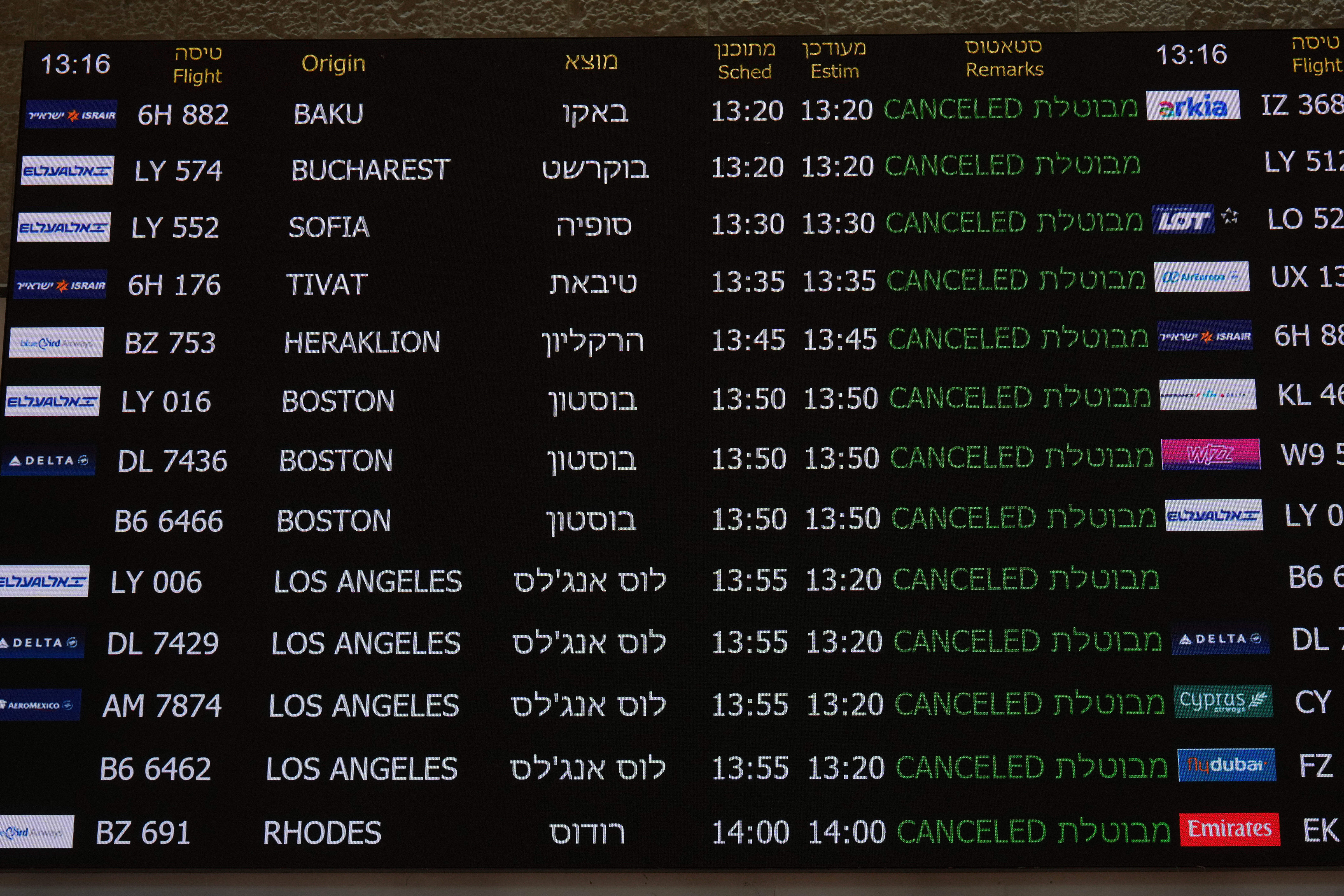 The flight information board at Israel's Ben Gurion Airport shows flight cancellations following an Israeli military strike on Iran, near Tel Aviv, Israel, Friday, June 13, 2025. (AP Photo/Ariel Schalit)