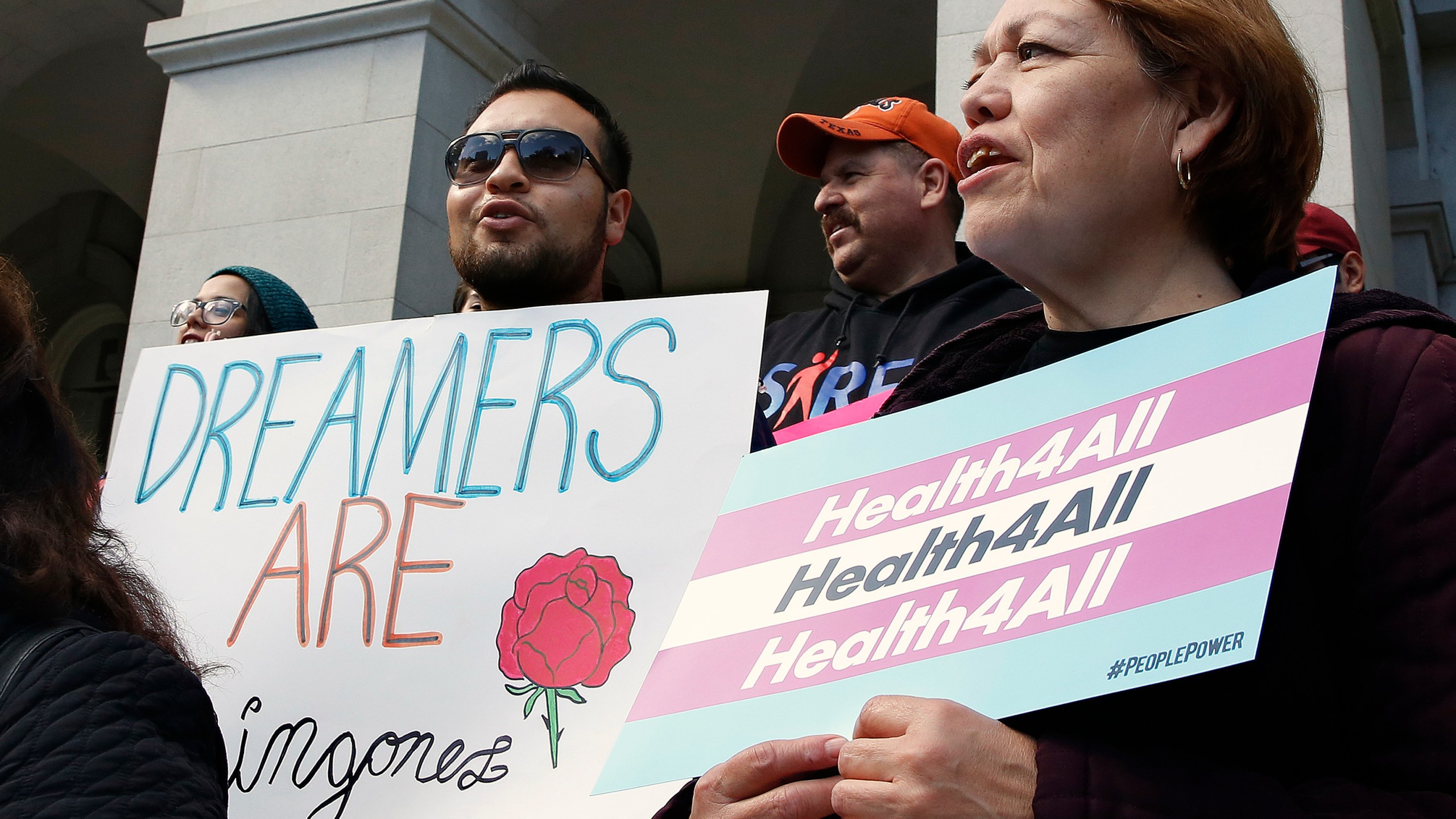 FILE - Supporters of proposals to expand California's government-funded health care benefits to undocumented immigrants gather at the Capitol for the Immigrants Day of Action, on May 20, 2019, in Sacramento, Calif. (AP Photo/Rich Pedroncelli, File)
