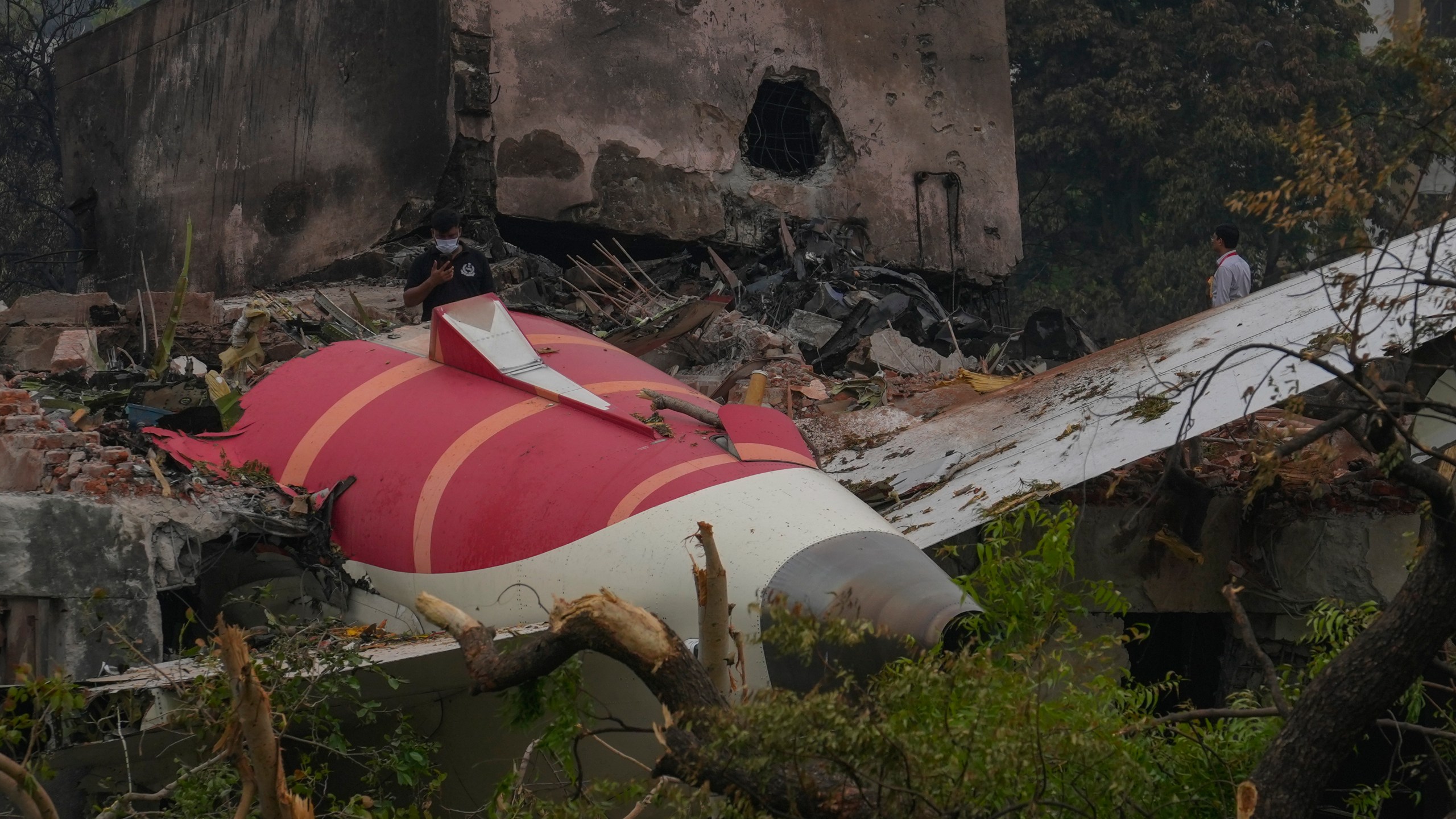 Parts of an Air India plane that crashed on Thursday are seen on top of a building in Ahmedabad, India, Friday, June 13, 2025. (AP Photo/Rafiq Maqbool)