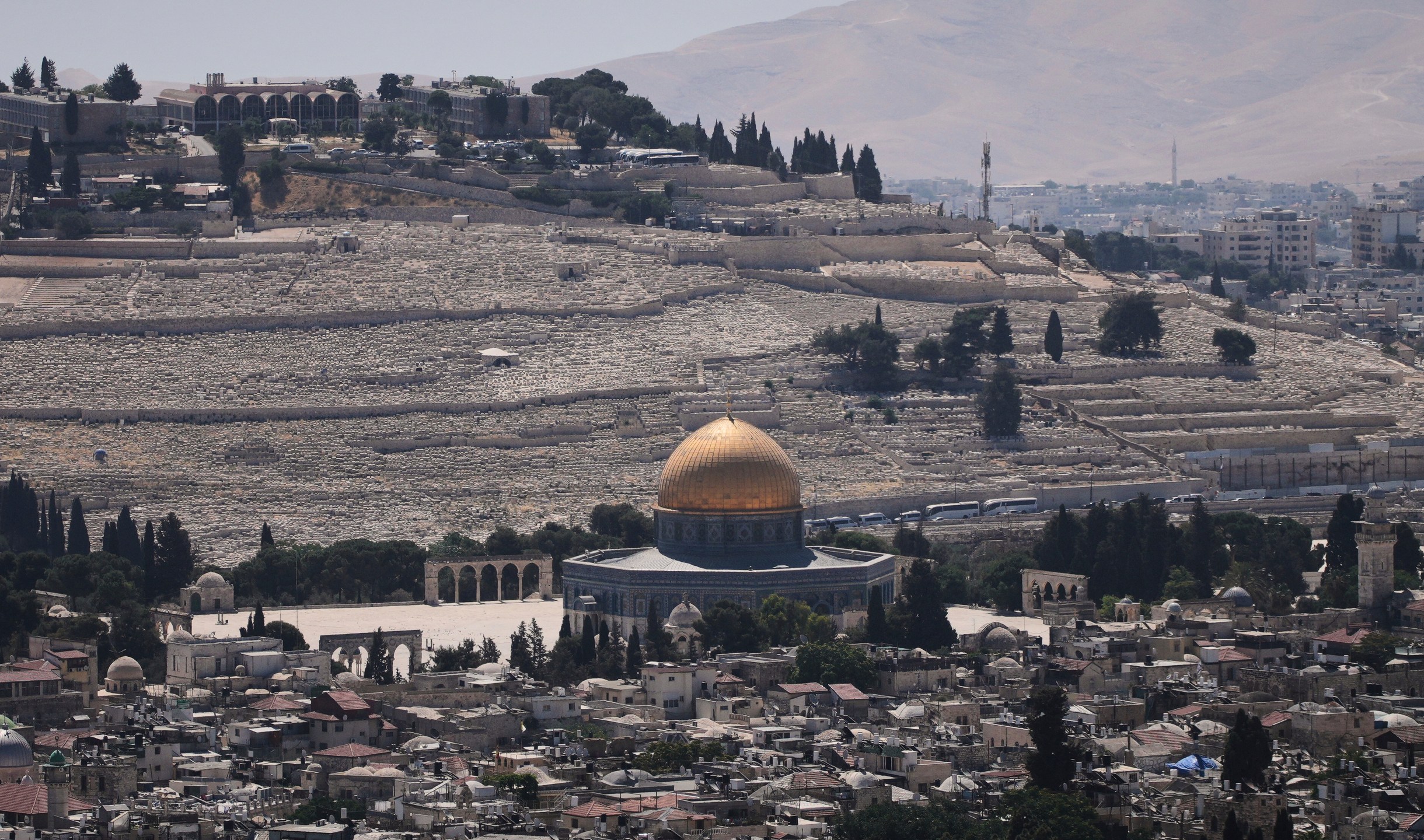 A view of Jerusalem's Old City, with the Dome of the Rock shrine in the Al-Aqsa Mosque compound, closed to worshippers after Israel's Homefront Command banned public gatherings following an Israeli military strike on Iran, Friday, June 13, 2025. (AP Photo/Ohad Zwigenberg)