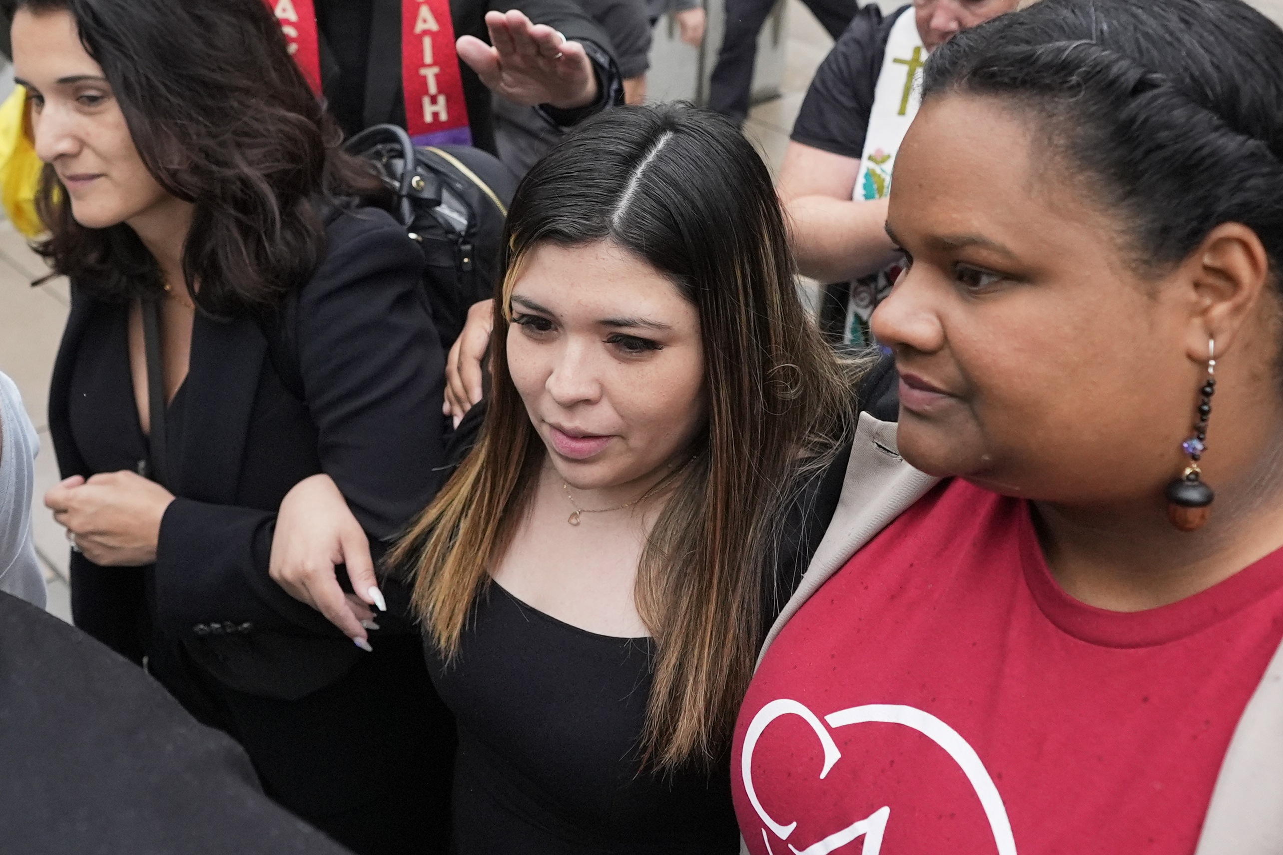 Jennifer Vasquez Sura, wife of Kilmar Abrego Garcia, center, is escorted out of the Federal Courthouse on Friday, June 13, 2025, in Nashville, Tenn. (AP Photo/George Walker IV)