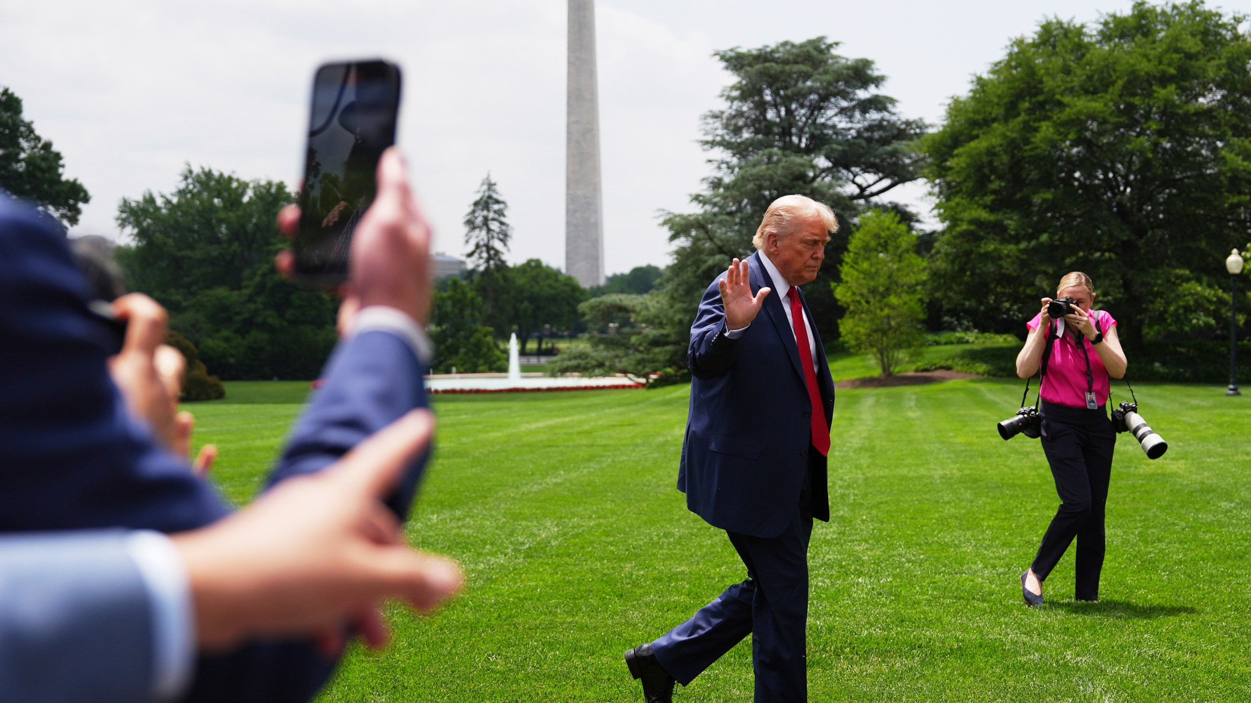 President Donald Trump arrives on the South Lawn of the White House, Monday, June 9, 2025, in Washington. The Washington Monument is seen in background. (AP Photo/Evan Vucci)