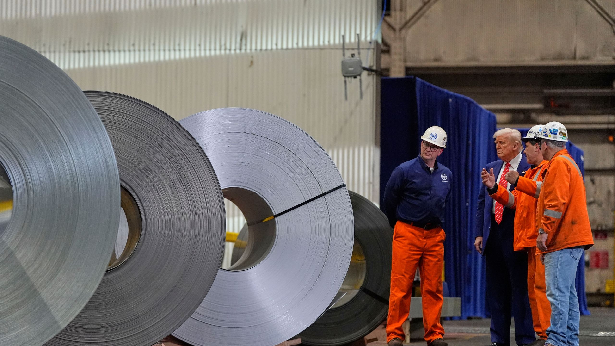 President Donald Trump talks to workers as he tours U.S. Steel Corporation's Mon Valley Works-Irvin plant, Friday, May 30, 2025, in West Mifflin, Pa. (AP Photo/Julia Demaree Nikhinson)