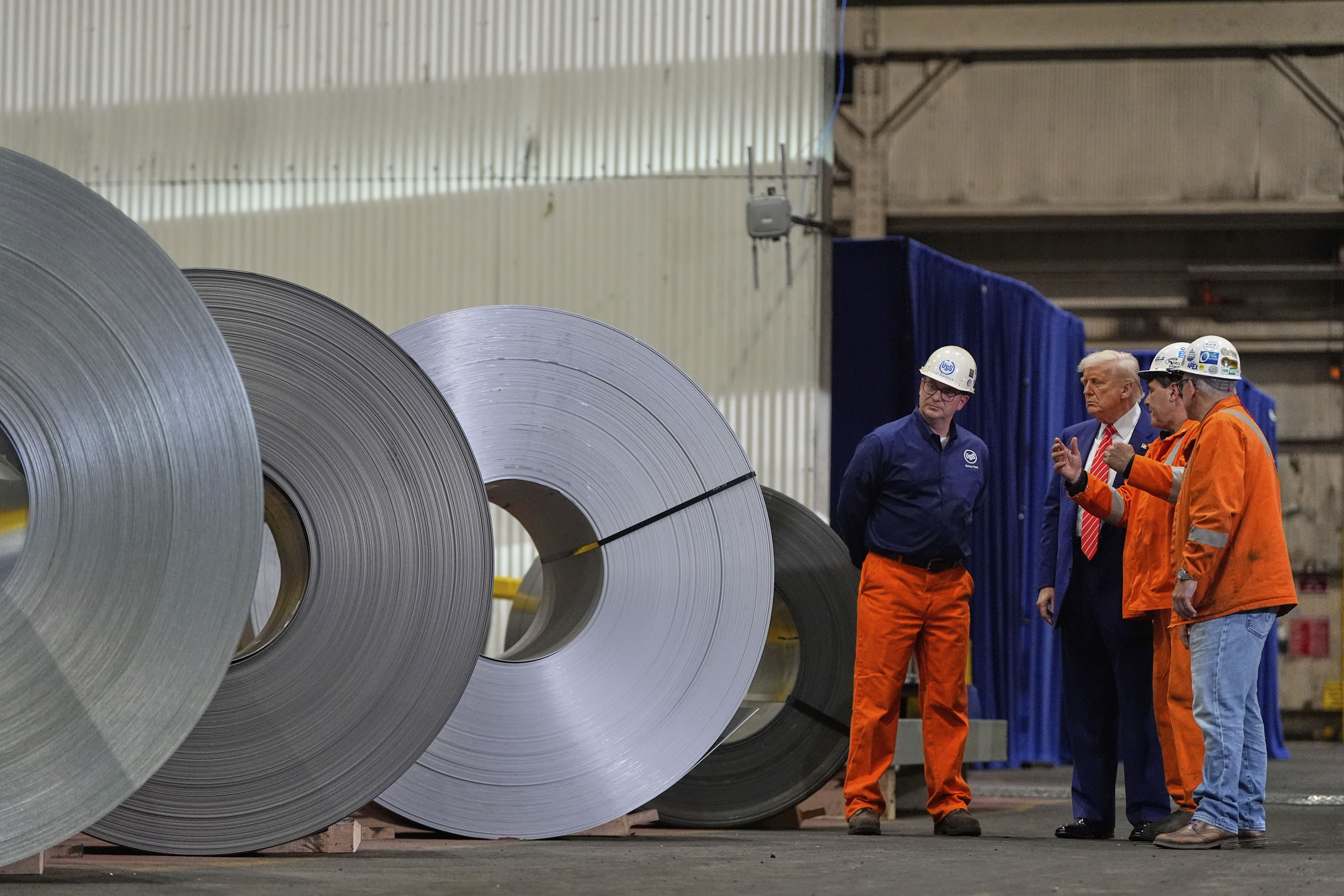 President Donald Trump talks to workers as he tours U.S. Steel Corporation's Mon Valley Works-Irvin plant, Friday, May 30, 2025, in West Mifflin, Pa. (AP Photo/Julia Demaree Nikhinson)