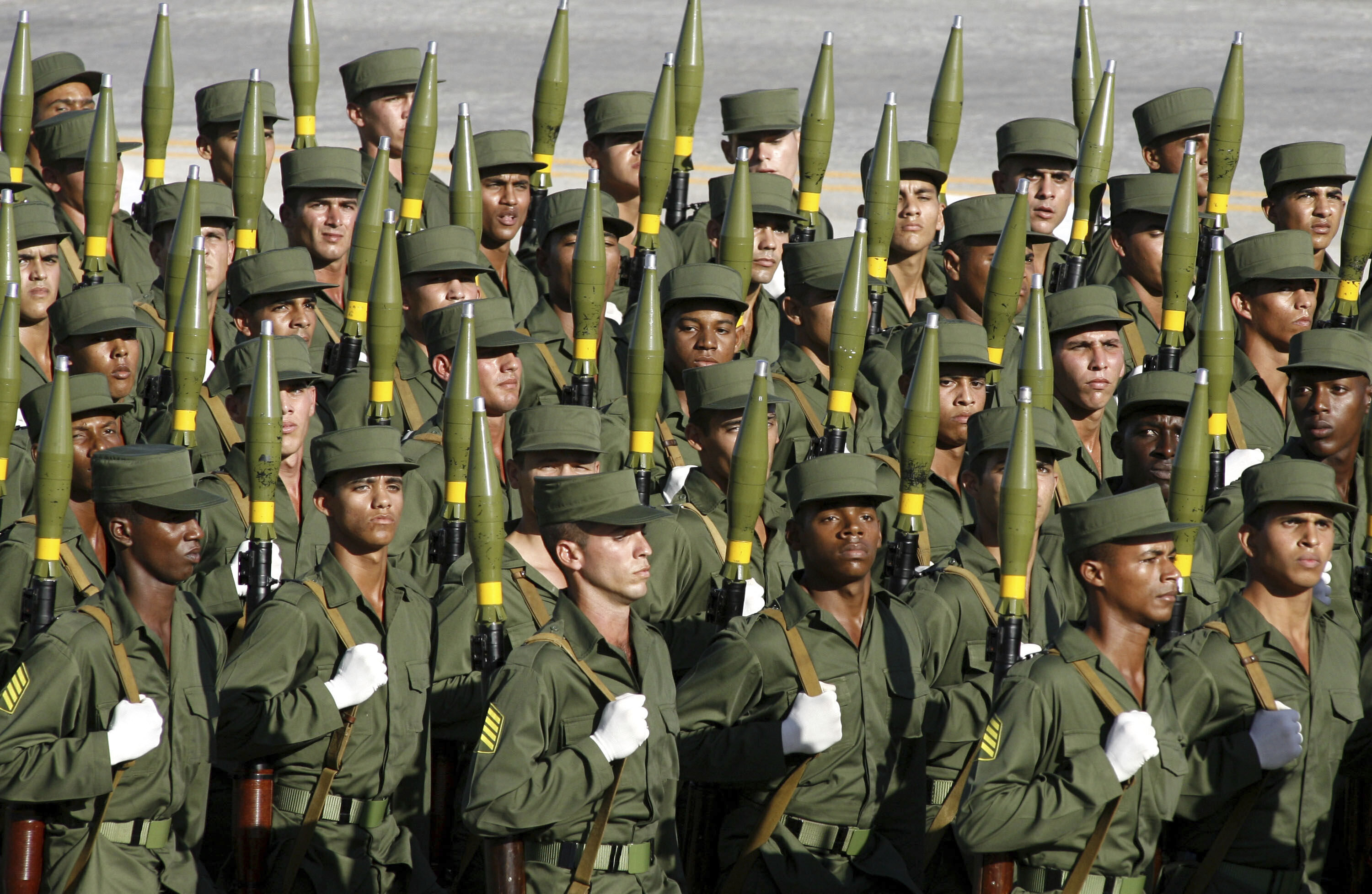 FILE - Cuban soldiers march during a military parade along the Revolution Square in Havana, Cuba, Dec. 2, 2006. (AP Photo/ Javier Galeano, File)