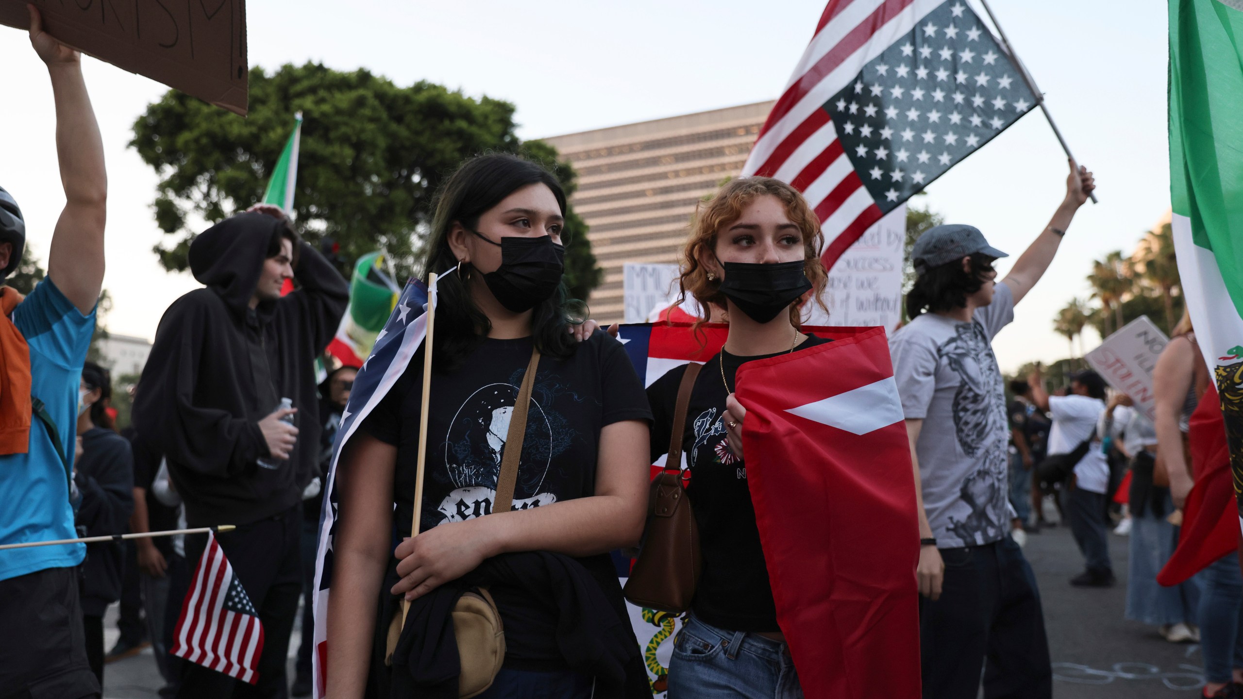 Protesters rally during a demonstration in response to a series of United States Immigration and Customs Enforcement (ICE) raids throughout the country, in Los Angeles, Calif., Thursday, June 12, 2025. (Gabrielle Lurie/San Francisco Chronicle via AP)