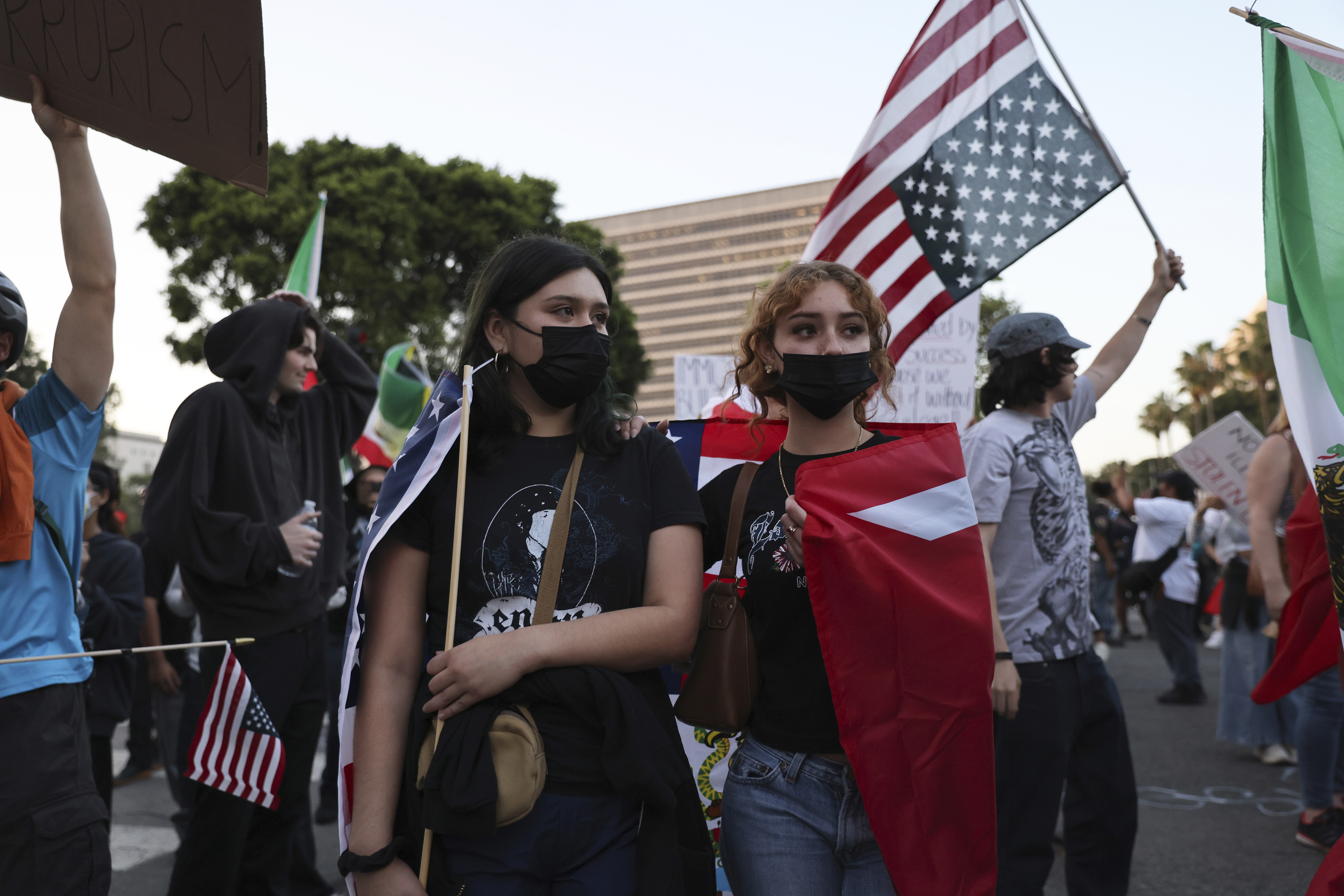 Protesters rally during a demonstration in response to a series of United States Immigration and Customs Enforcement (ICE) raids throughout the country, in Los Angeles, Calif., Thursday, June 12, 2025. (Gabrielle Lurie/San Francisco Chronicle via AP)