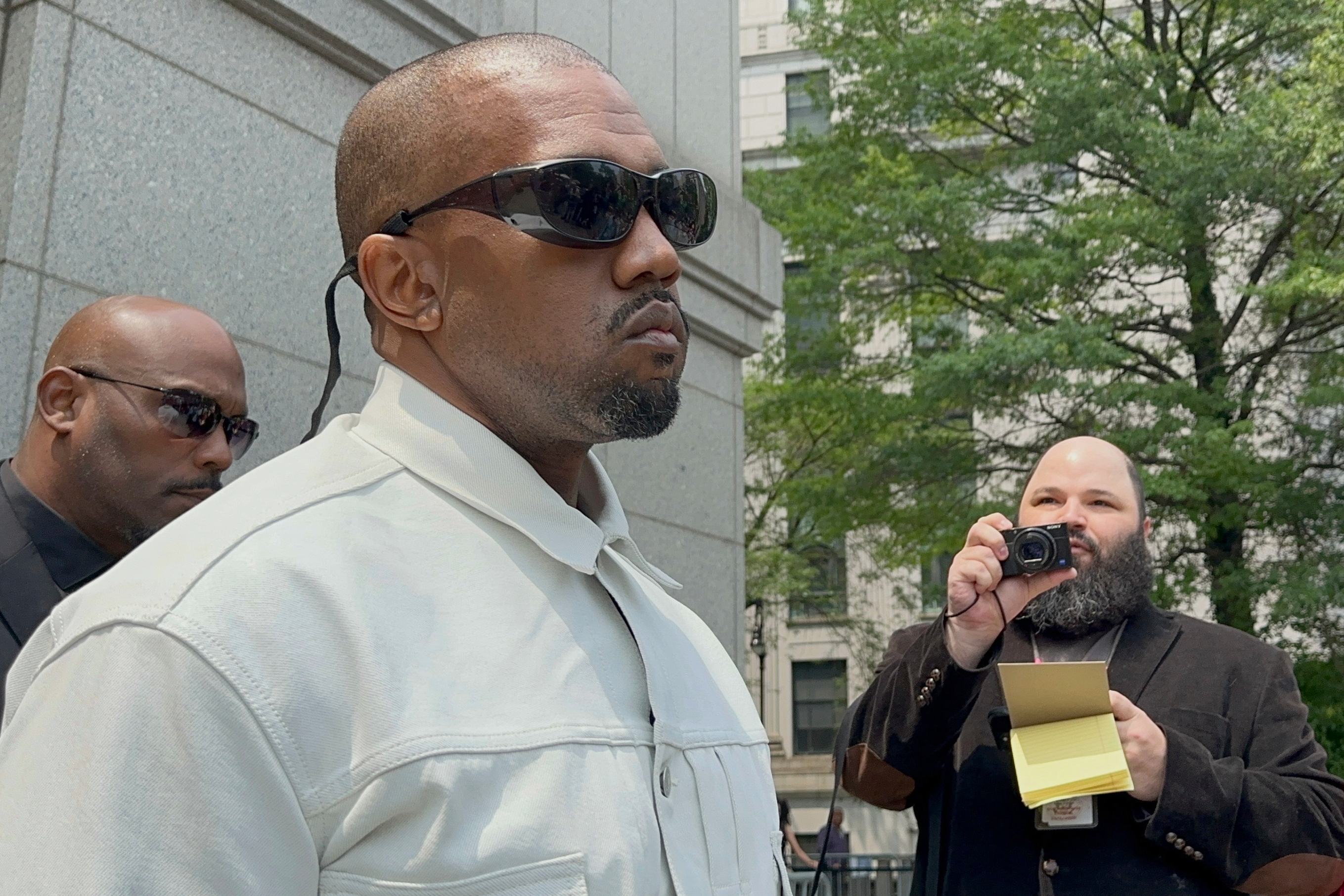 Ye, the rapper formerly known as Kanye West, leaves federal court during the trial of Sean "Diddy" Combs in New York, Friday, June 13, 2025. (AP Photo/Larry Neumeister)