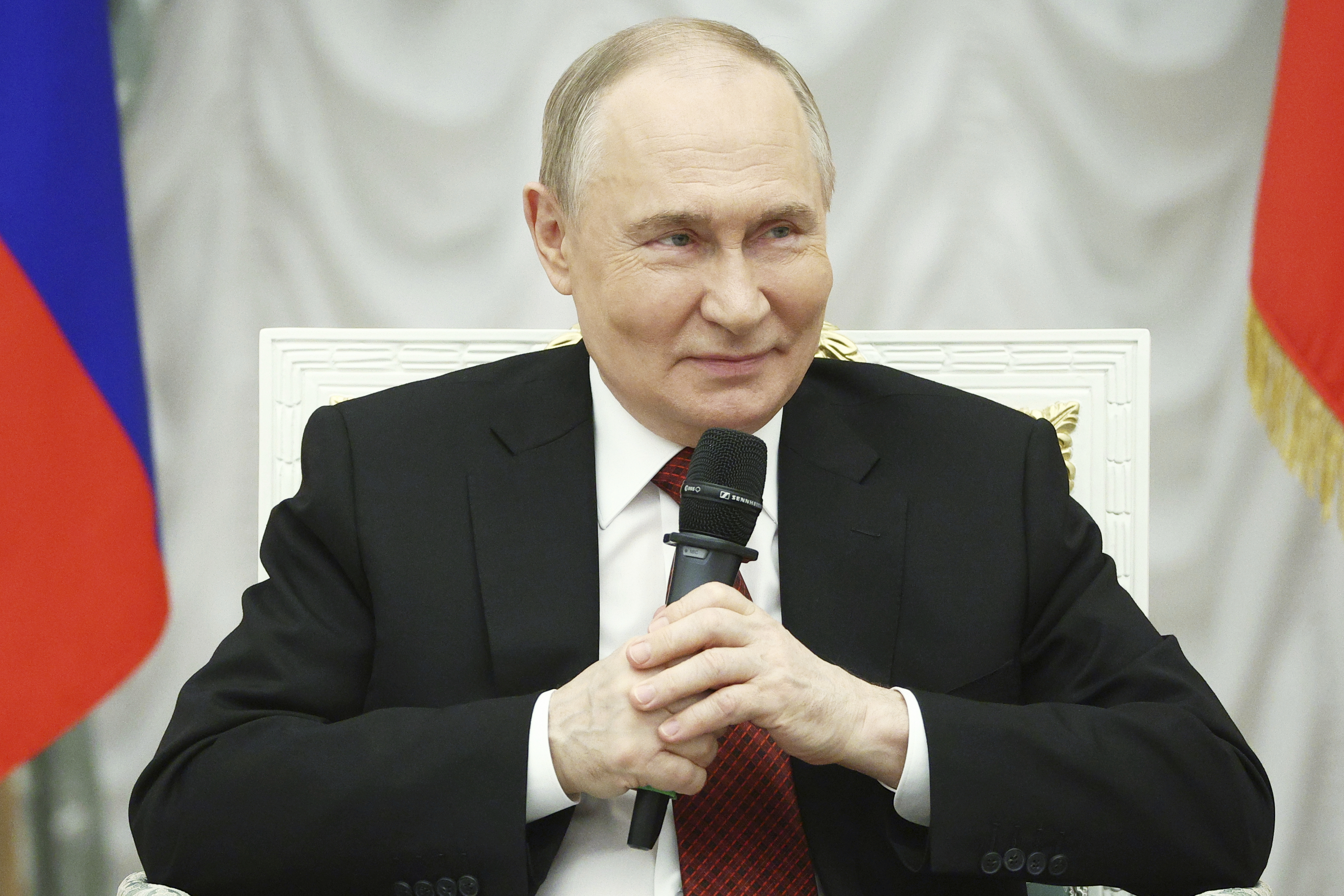 Russian President Vladimir Putin speaks with participants of the Time of Heroes, an educational program for veterans of special military operation, at the Kremlin in Moscow, Russia, Thursday, June 12, 2025. (Sergei Bulkin, Sputnik, Kremlin Pool Photo via AP)
