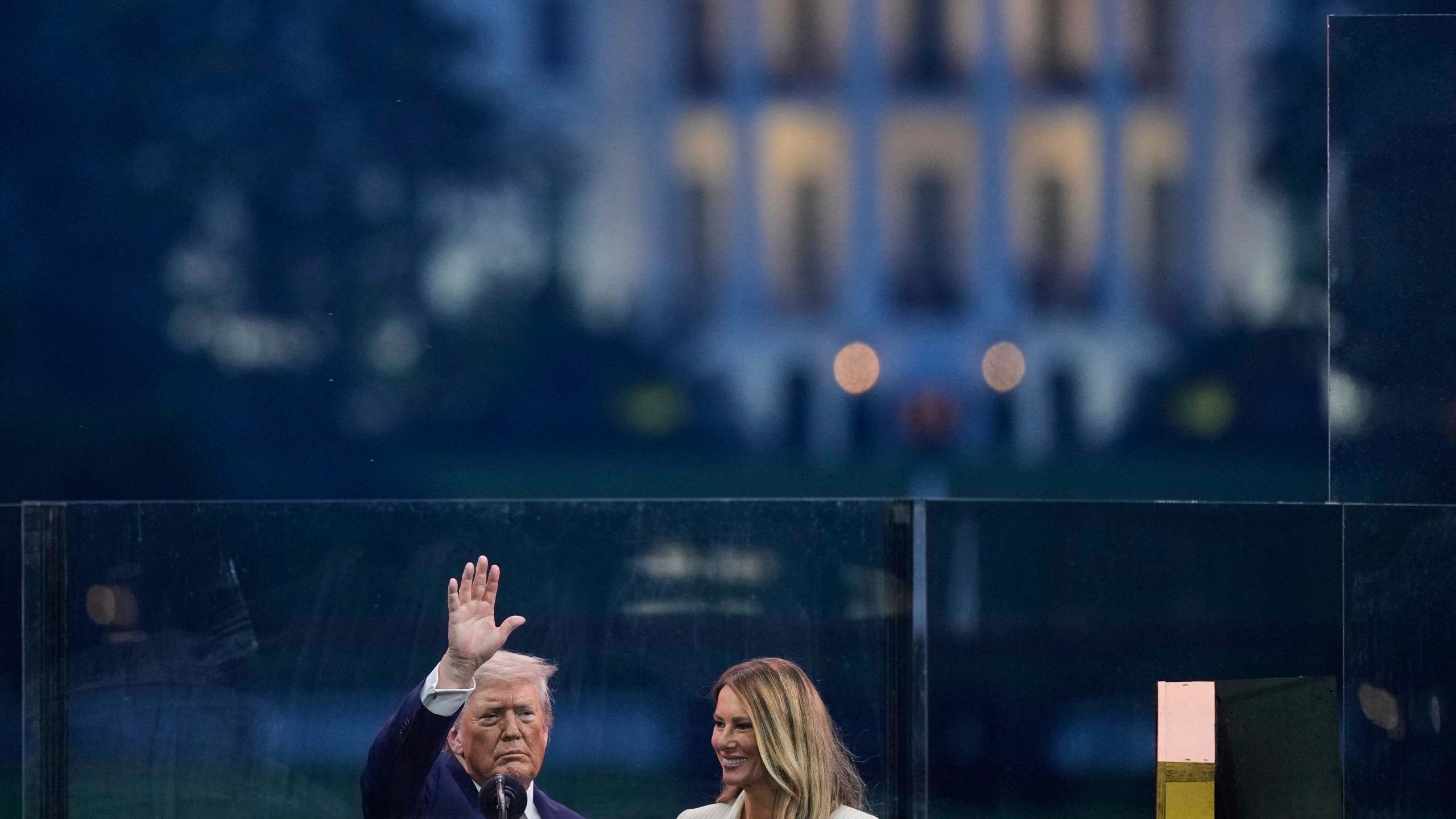 President Donald Trump and first lady Melania Trump attend a military parade commemorating the Army's 250th anniversary, coinciding with his 79th birthday, Saturday, June 14, 2025, in Washington. (AP Photo/Julia Demaree Nikhinson)