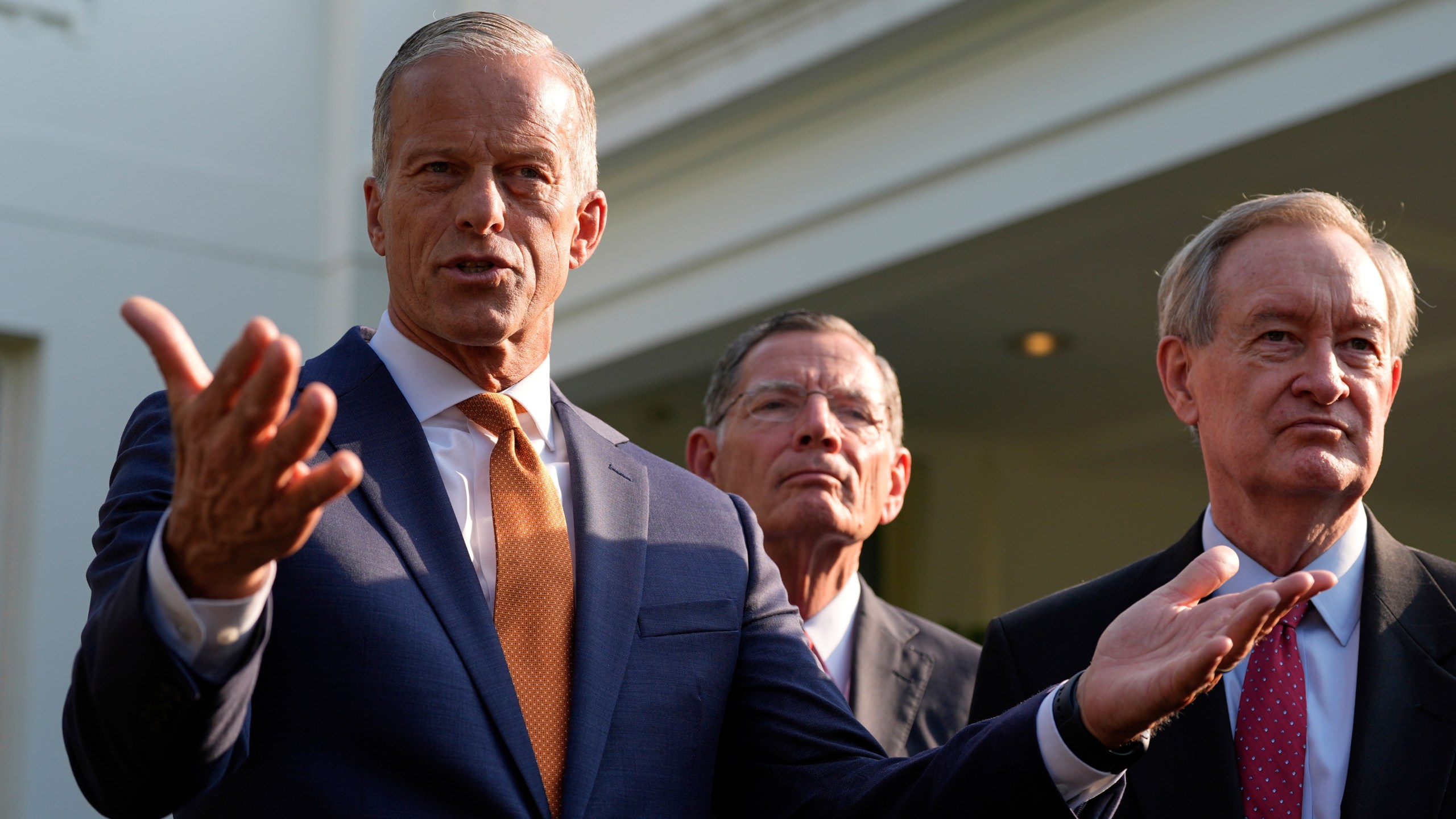 FILE - Senate Majority Leader John Thune, R-S.D., flanked by Sen. John Barrasso, R-Wyo., center, and Sen. Mike Crapo, R-Idaho, speak with reporters after meeting with President Donald Trump at the White House, June 4, 2025, in Washington. (AP Photo/Alex Brandon, file)