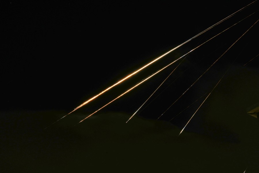 Traces of projectile illuminates the sky seen from northern Israel, Saturday, June 14, 2025. (AP Photo/Ariel Schalit)