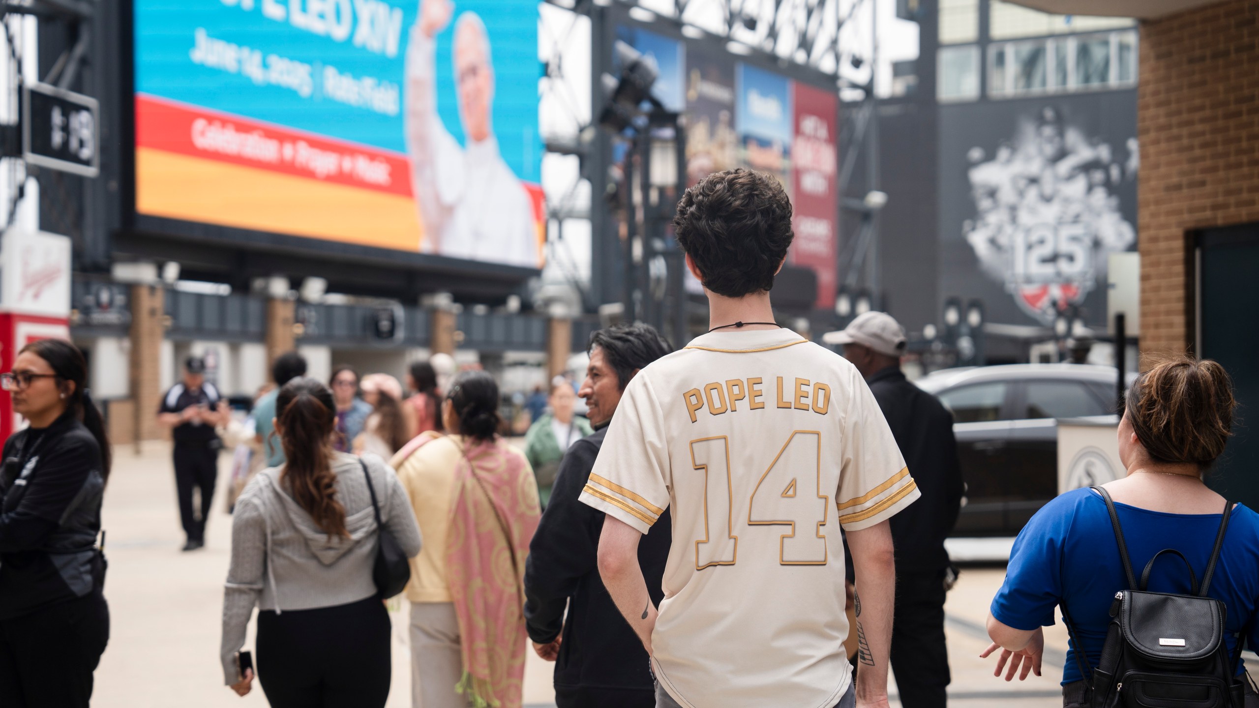 Ethan Peebles wears a Pope Leo jersey during the Archdiocese of Chicago's celebration of Pope Leo XIV at Rate Field, Saturday, June 14, 2025. (Pat Nabong/Chicago Sun-Times via AP)