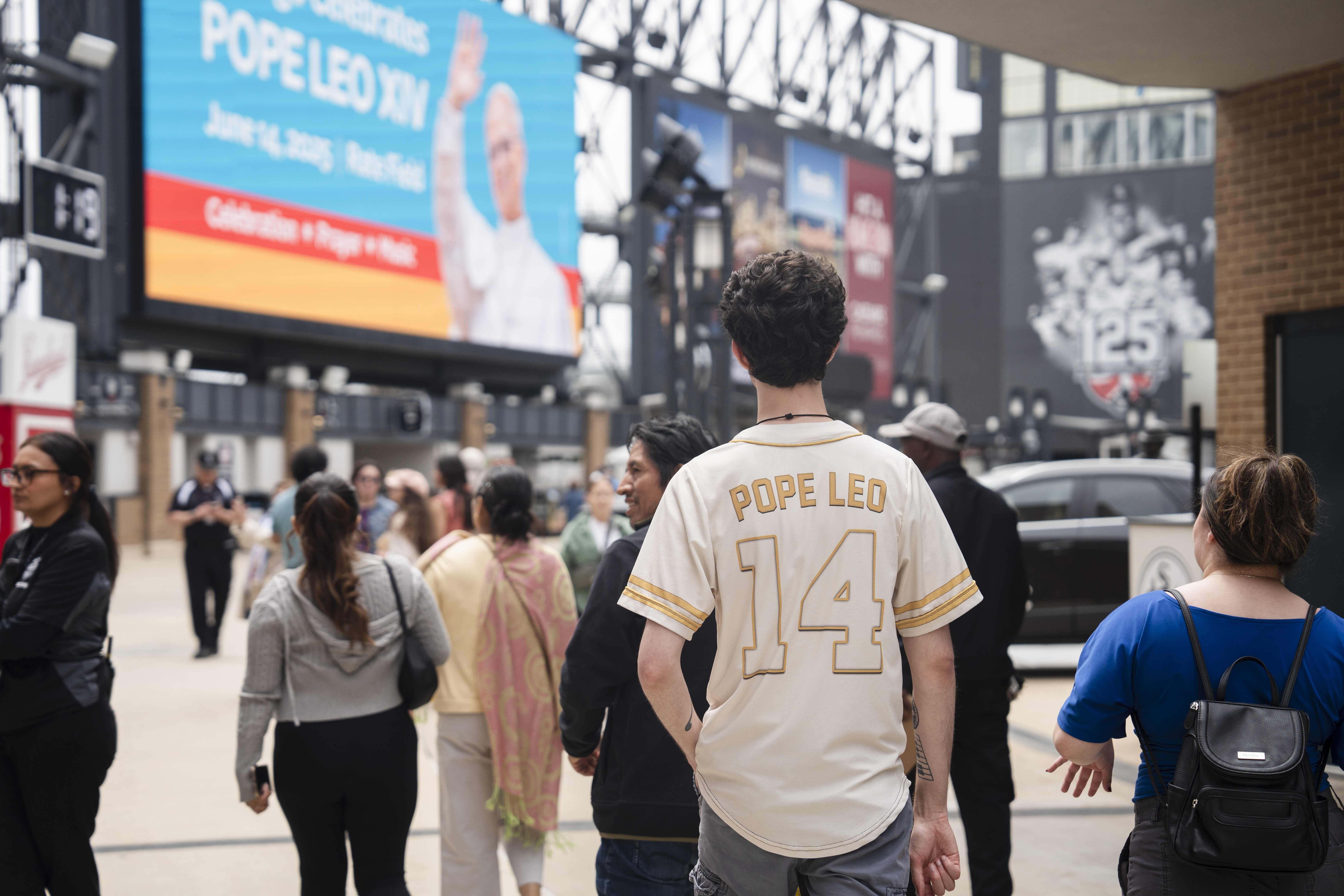 Ethan Peebles wears a Pope Leo jersey during the Archdiocese of Chicago's celebration of Pope Leo XIV at Rate Field, Saturday, June 14, 2025. (Pat Nabong/Chicago Sun-Times via AP)