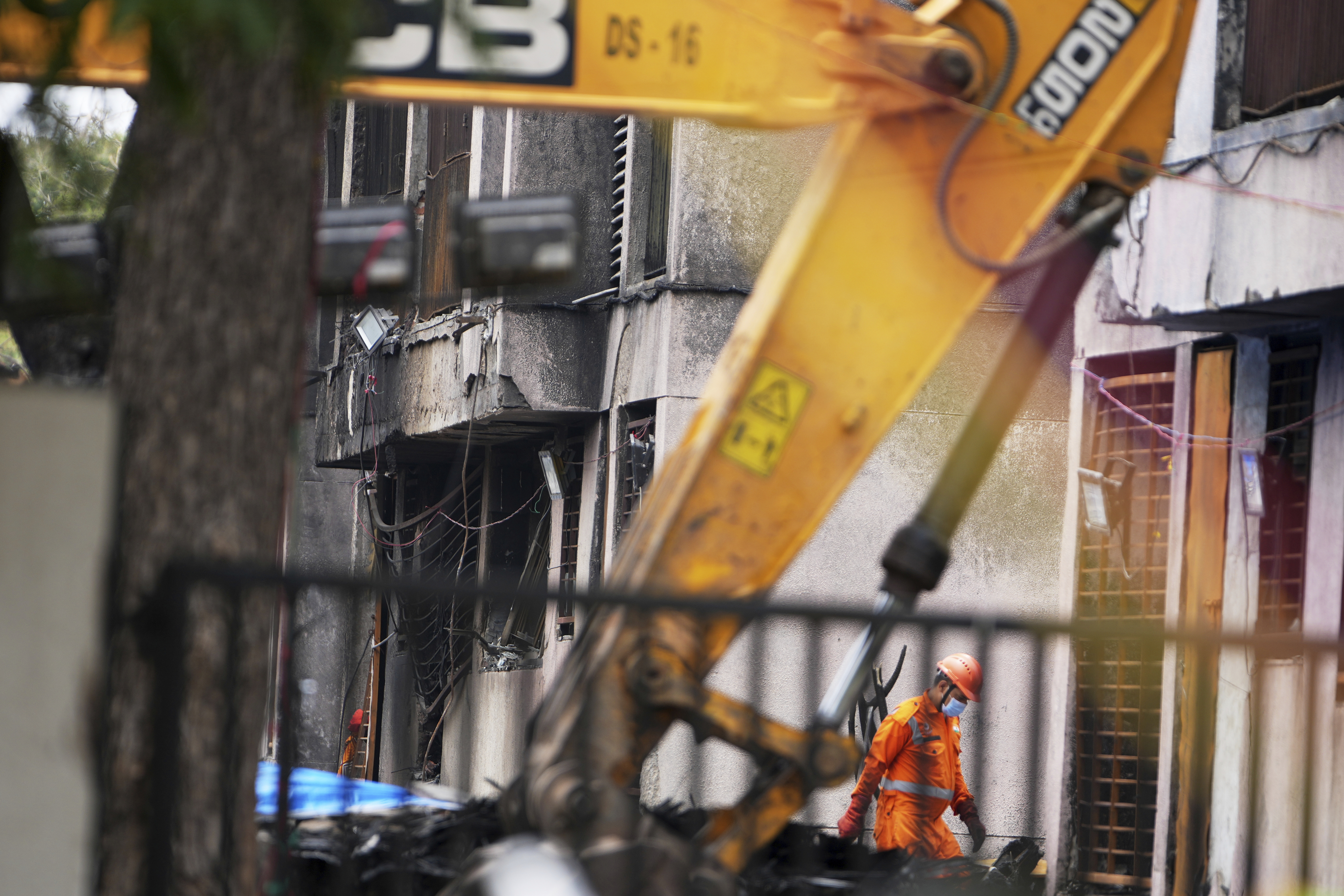 A member of the National Disaster Response Force is seen at Thursday's Air India plane crash site in Ahmedabad, India, Sunday, June 15, 2025. (AP Photo/Ajit Solanki)