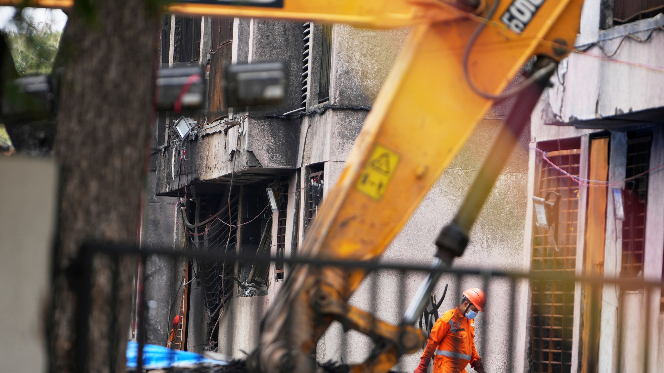 A member of the National Disaster Response Force is seen at Thursday's Air India plane crash site in Ahmedabad, India, Sunday, June 15, 2025. (AP Photo/Ajit Solanki)