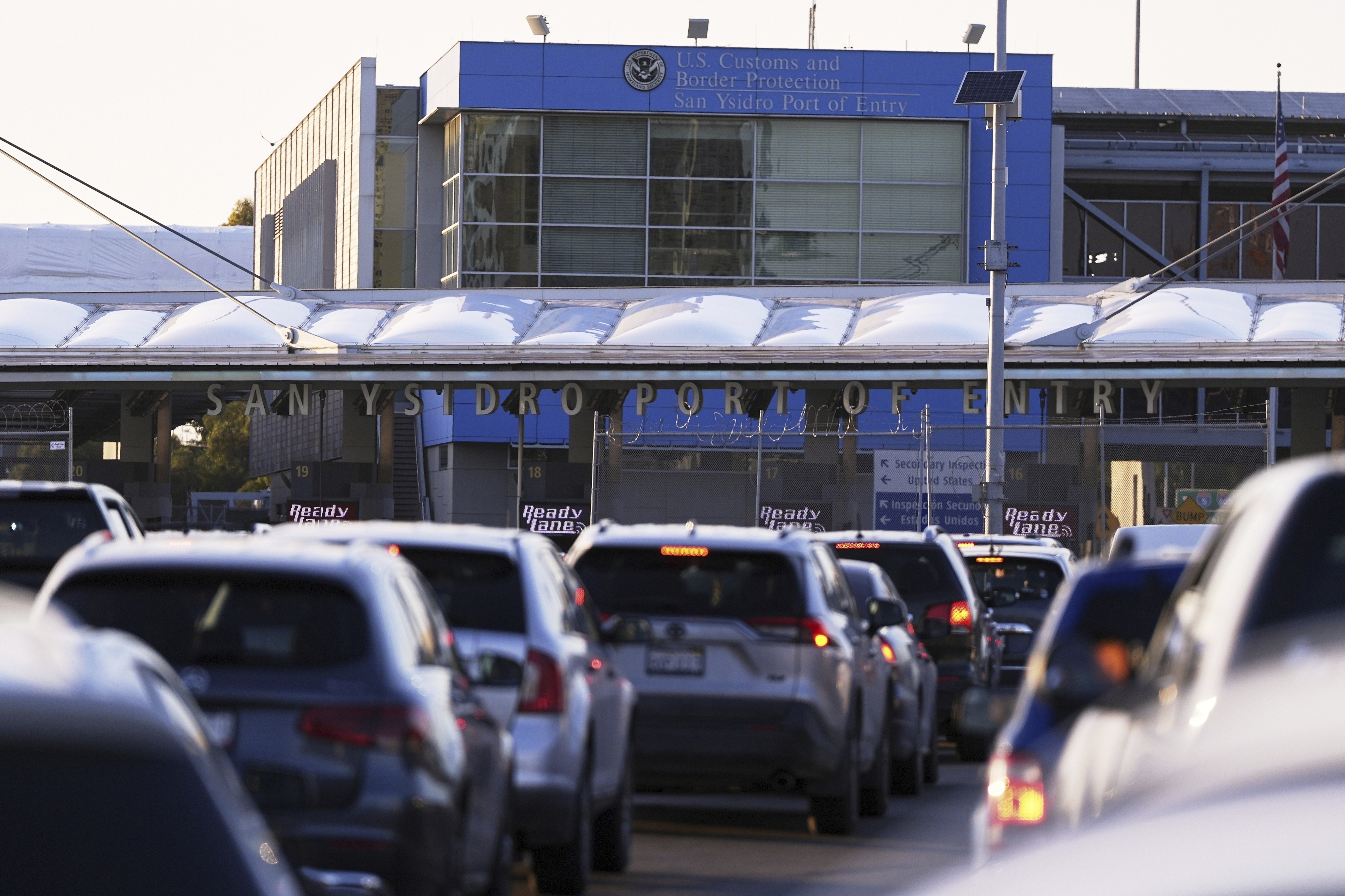FILE - Vehicles wait in line to cross the border into the United States at the San Ysidro Port of Entry, March 18, 2025, in Tijuana, Mexico. (AP Photo/Gregory Bull, File)