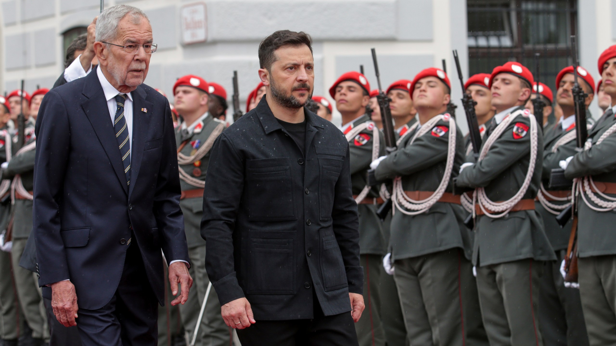 Ukraine's President Volodymyr Zelenskyy, right, and Austrian President Alexander van Der Bellen walk past the honour guard in Vienna, Austria, Monday, June 16, 2025. (AP Photo/Heinz-Peter Bader)